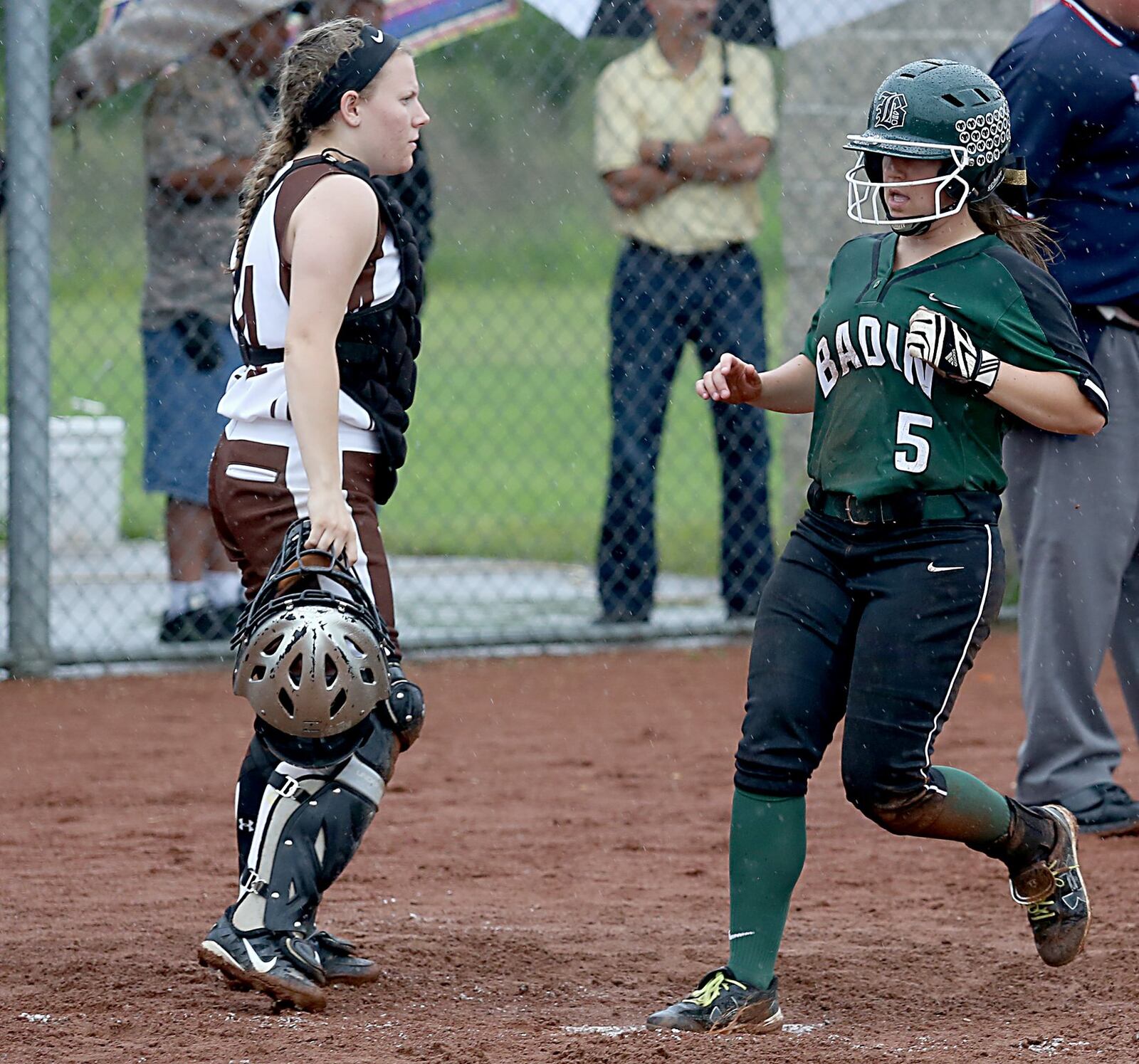 Badin’s Allie Link scores a run as Roger Bacon catcher Brittany Jerger waits for a throw during a Division III district softball final at Kings on May 20, 2016. Badin won 9-2. JOURNAL-NEWS FILE PHOTO