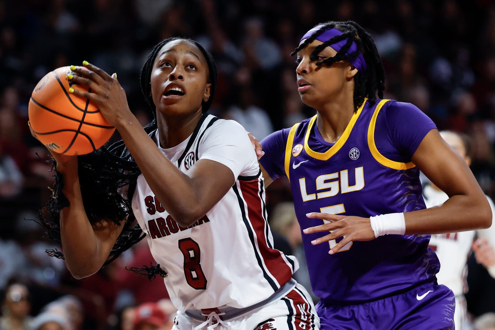 South Carolina forward Joyce Edwards (8) looks to shoot against LSU forward Sa'Myah Smith, right, during the first half of an NCAA college basketball game in Columbia, S.C., Friday, Jan. 24, 2025. (AP Photo/Nell Redmond)