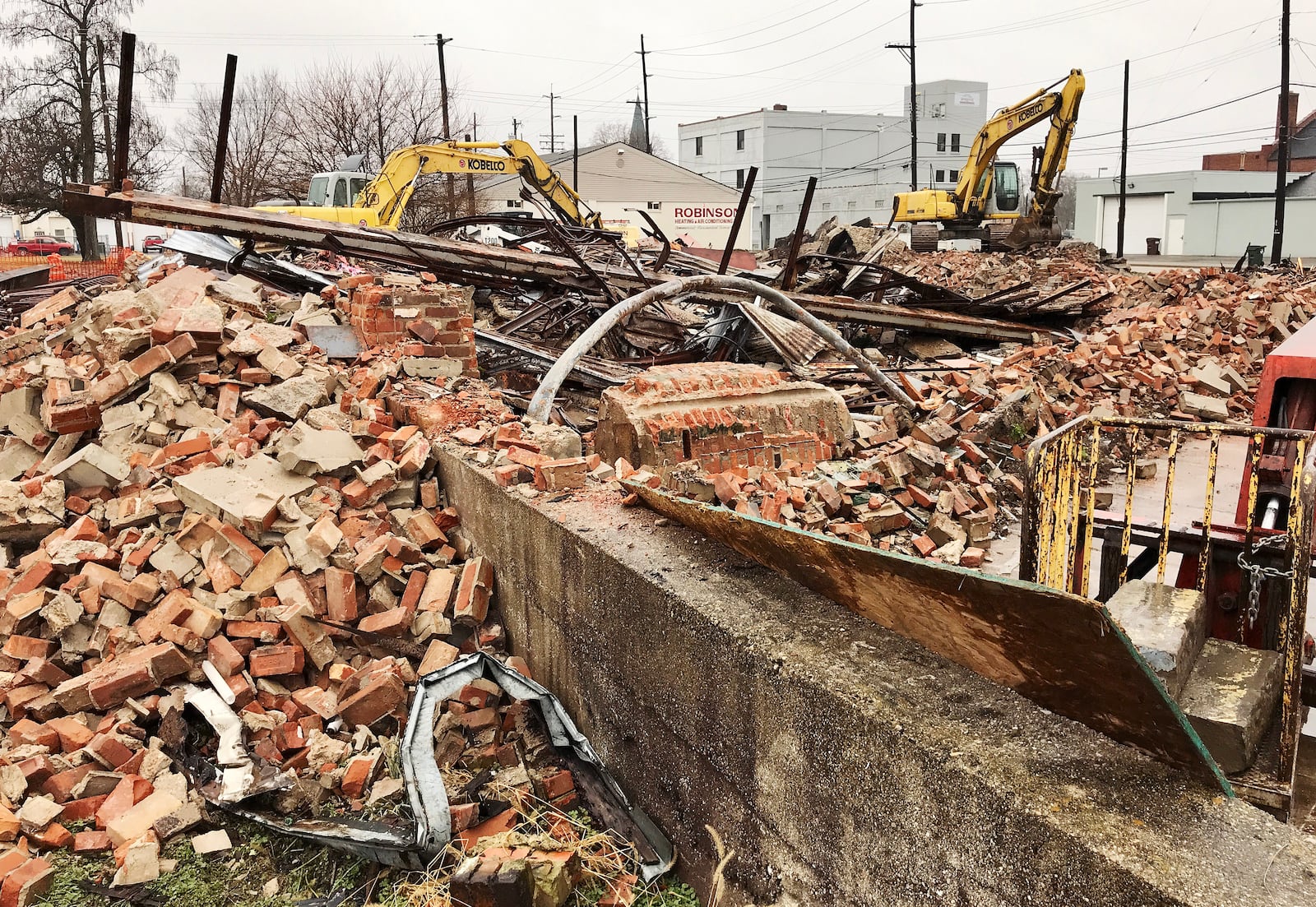 Crews demolish the old Schwinn bicycle shop at the corner of Verity Parkway and 2nd Avenue Jan. 12 in Middletown. NICK GRAHAM/STAFF