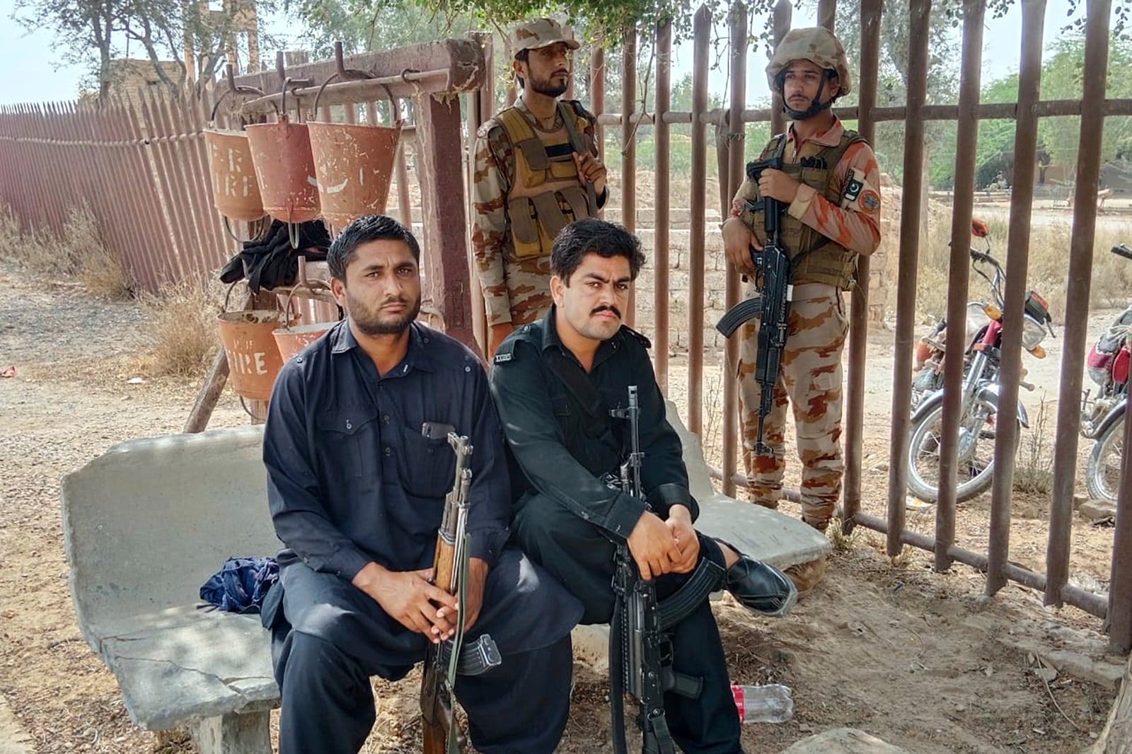 Paramilitary soldiers and police officers deploy at a railway station near the attack site of a passenger train by insurgents, in Mushkaf in Bolan district of Pakistan's southwestern Balochistan province, Wednesday, March 12, 2025. (AP Photo)