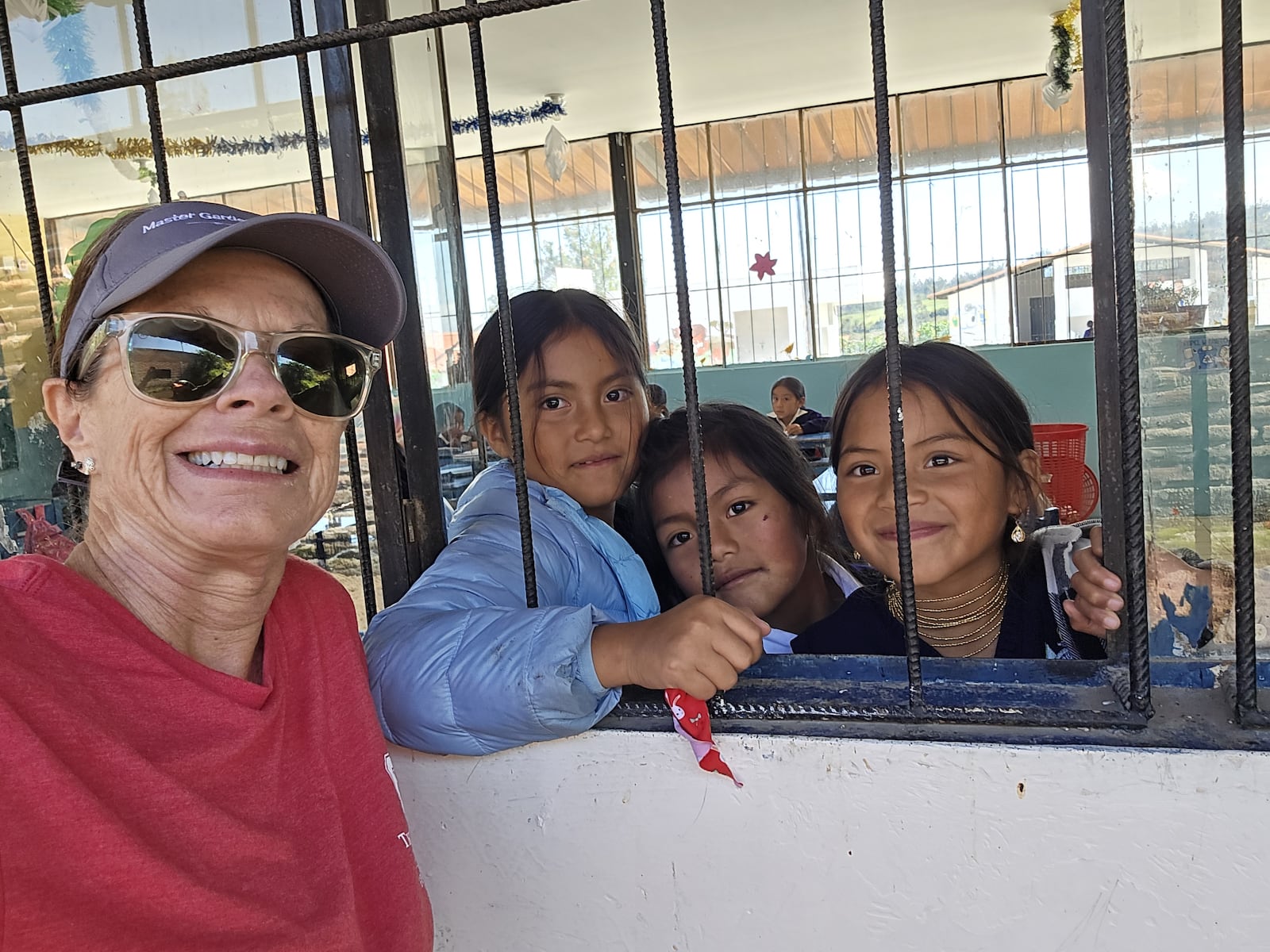 Pam Corle Bennett hanging out with the school kids practicing Spanish and English during a break