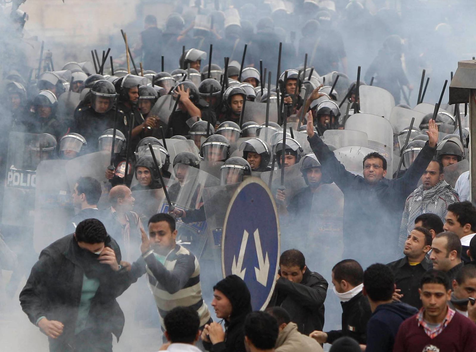 FILE - Anti-government activists clash with riot police in Cairo, Egypt, on Jan. 28, 2011, to challenge President Hosni Mubarak's 30-year rule. (AP Photo/Ben Curtis)