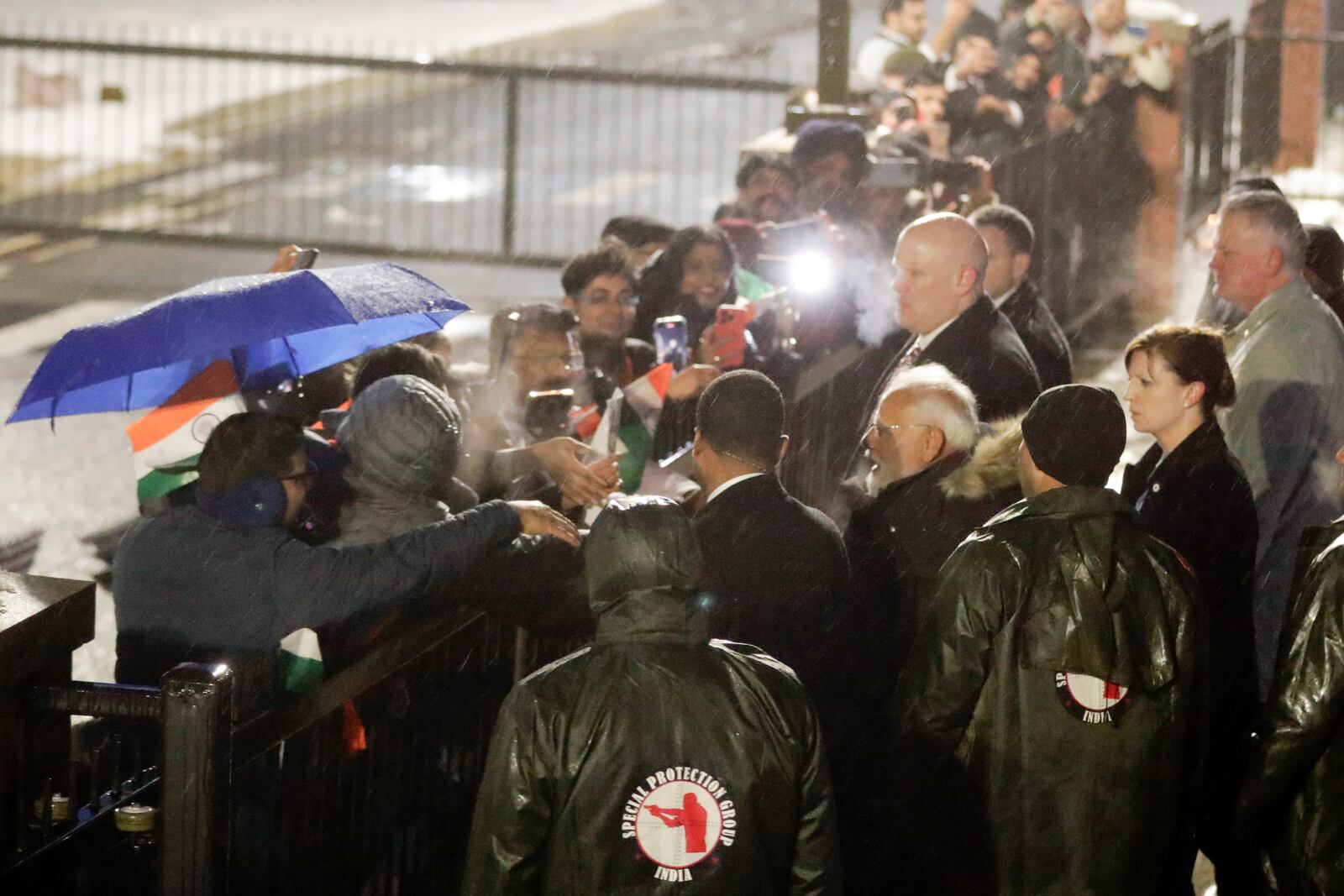 India's Prime Minister Narendra Modi talks to members of the Indian community upon his arrival at Joint Base Andrews, Md., Wednesday, Feb. 12, 2025. (AP Photo/Luis M. Alvarez)