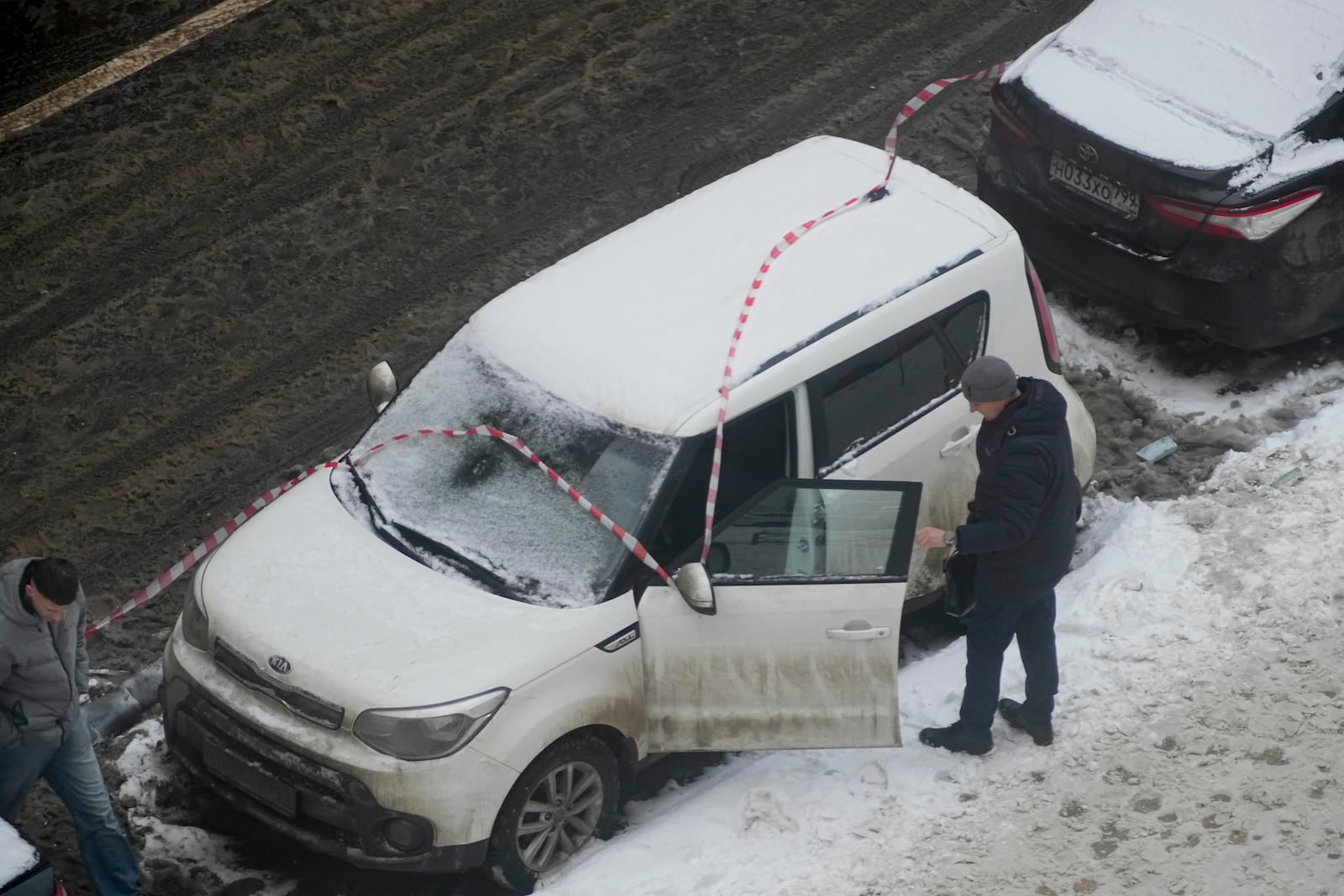 Investigators work at the place where Lt. General Igor Kirillov, the head of Russia's Nuclear, Biological, and Chemical Defence Forces and his assistantIlya Polikarpov were killed by an explosive device planted close to a residential apartment's block in Moscow, Russia, Tuesday, Dec. 17, 2024. (AP Photo)