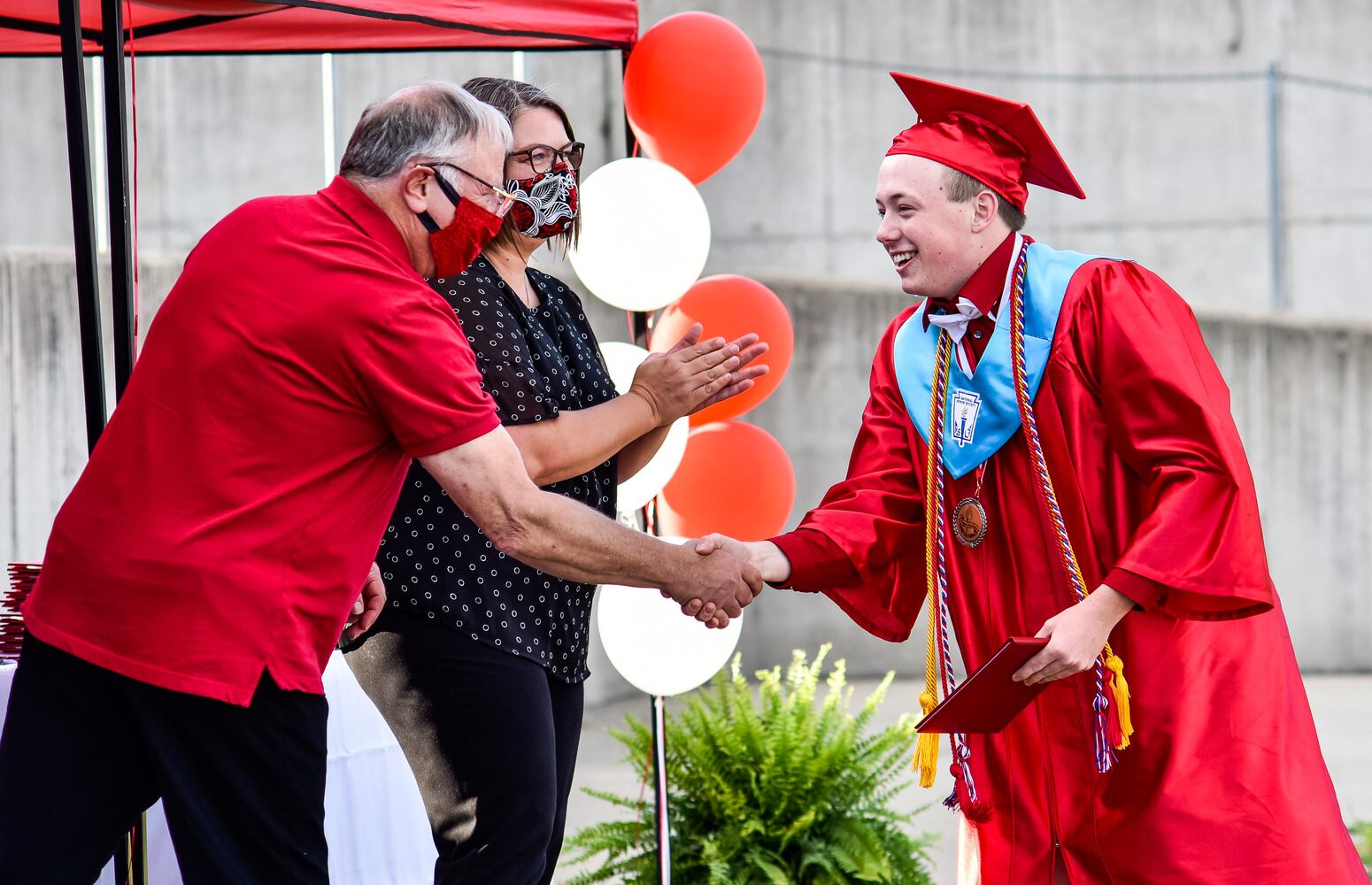 Madison High School drive-thru graduation ceremony at Land of Illusion