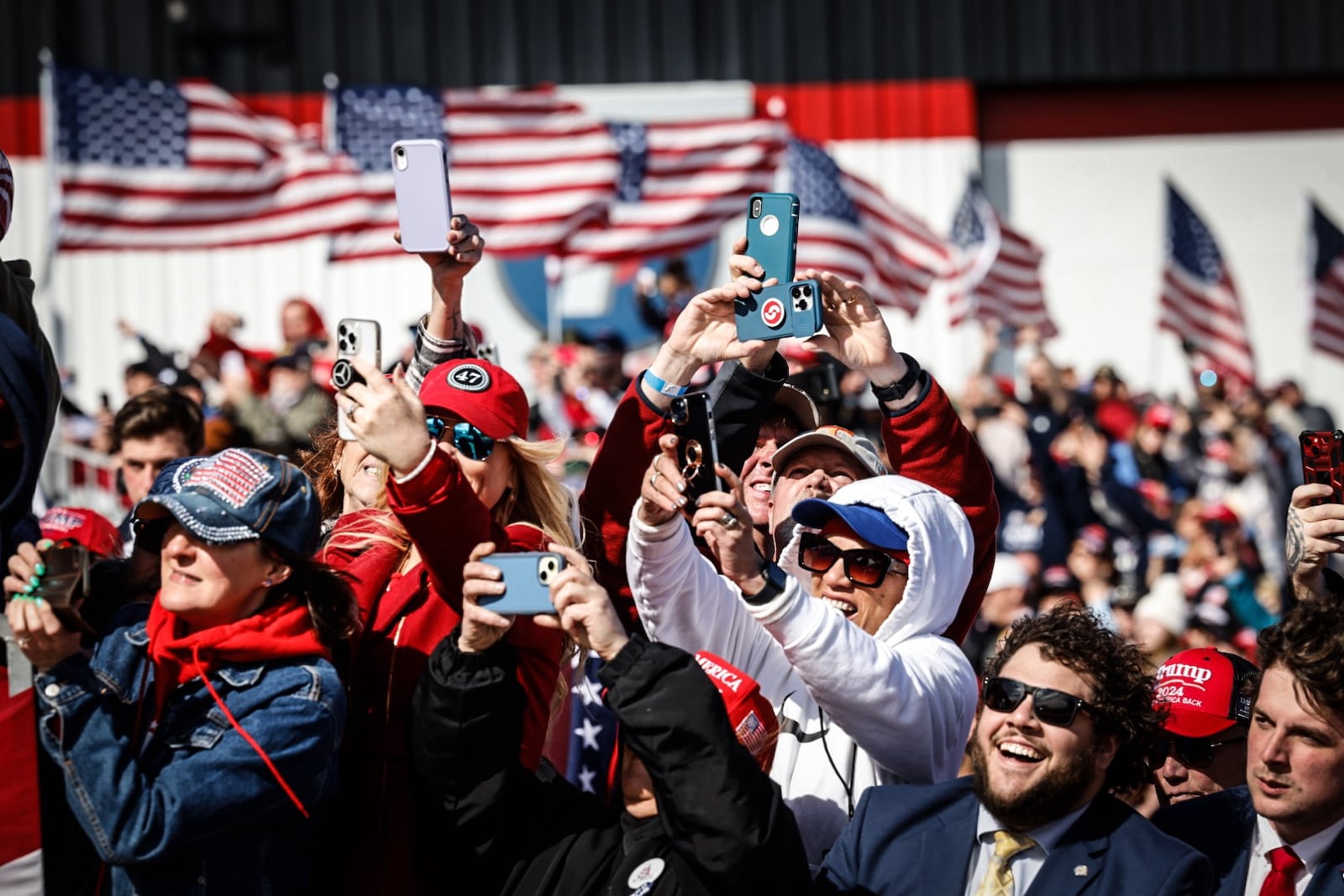 Trump fans celebrate the Republican presidential candidate Donald Trump at Wright Bros Aero Inc.Jim Noelker/Staff 