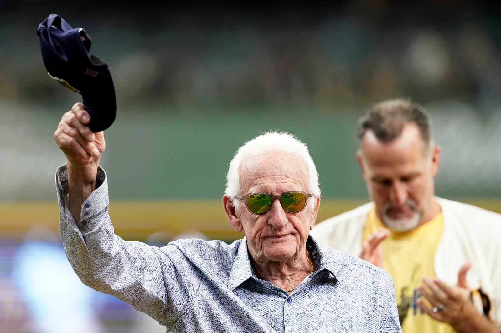 FILE - Milwaukee Brewers radio announcer Bob Uecker tips his cap before a baseball game between the Milwaukee Brewers and the Miami Marlins,, July 28, 2024, in Milwaukee. (AP Photo/Aaron Gash)