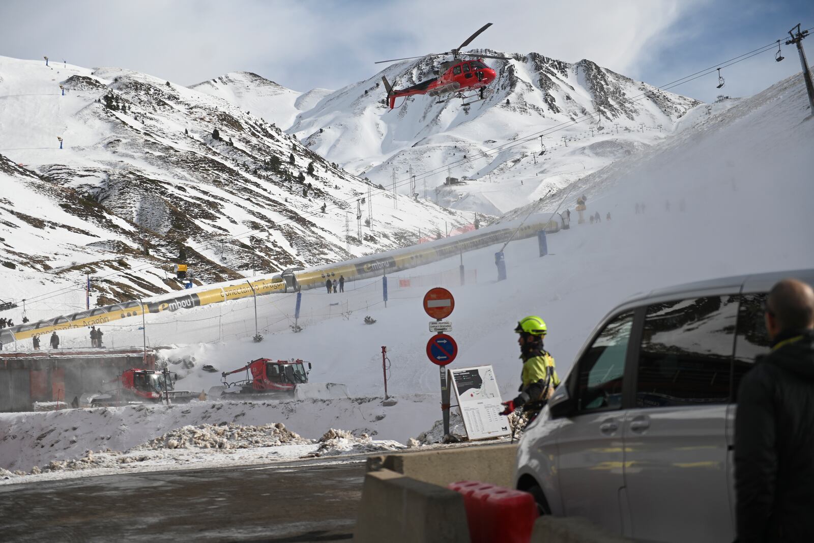 An emergency helicopter flies over the ski lifts at the Astum ski resort in Huesca, Spain, northern Spain on Saturday, Jan 18, 2025, where several people have been injured. (Verónica Lacasa/Europa Press via AP) **SPAIN OUT**