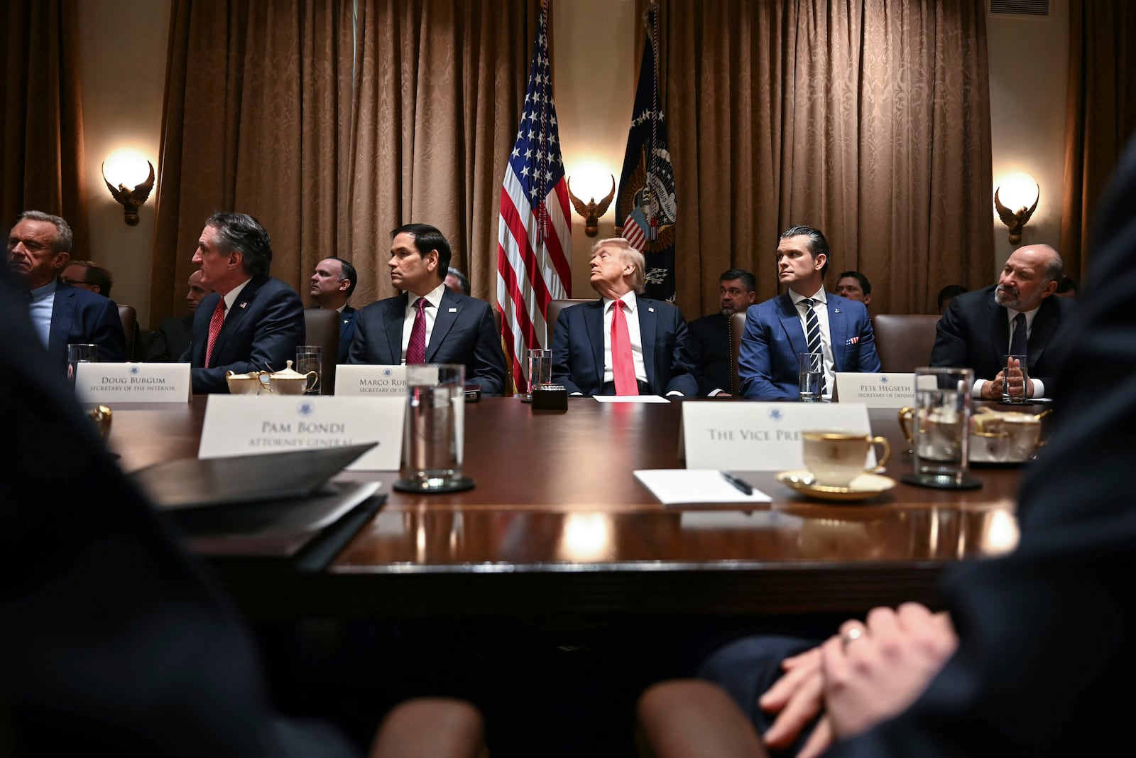 President Donald Trump holds his first Cabinet meeting at the White House in Washington, Wednesday, Feb. 26, 2025. (Pool via AP)