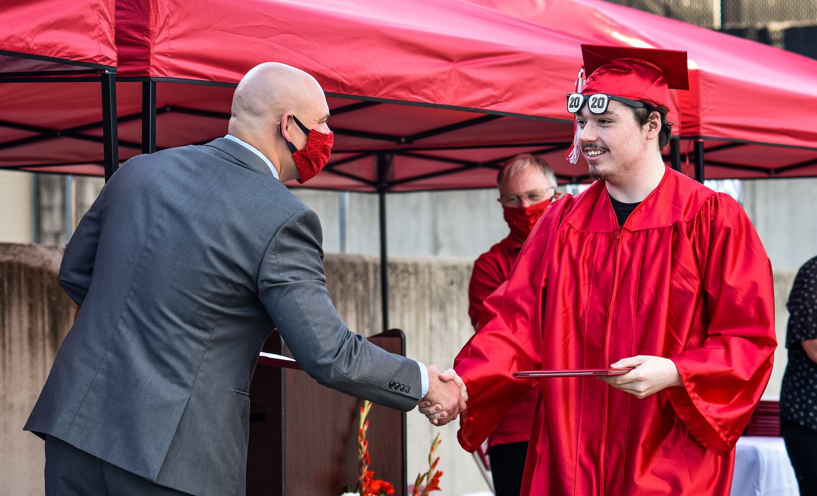 Madison High School drive-thru graduation ceremony at Land of Illusion