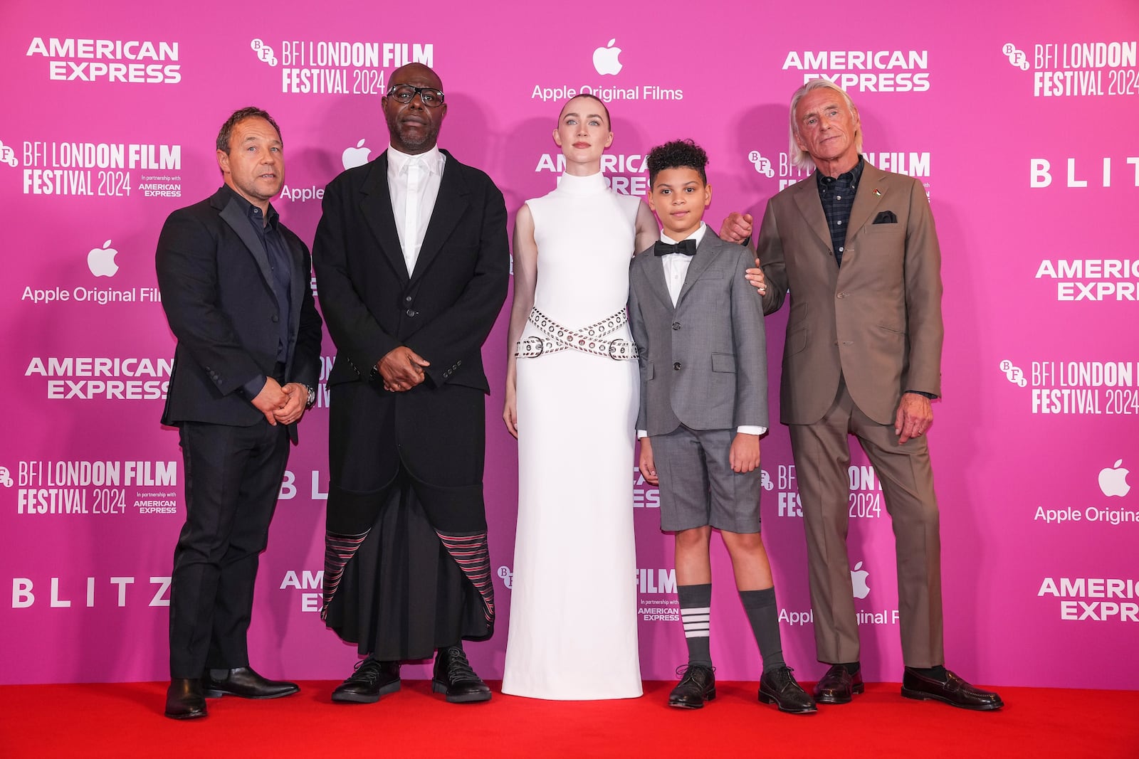 Producer Stephen Graham, from left, director Steve McQueen, Saoirse Ronan, Elliott Heffernan and Paul Weller pose for photographers upon arrival at the premiere for the film 'Blitz' and the opening gala of the London Film Festival on Wednesday, Oct. 9, 2024, in London. (Photo by Scott A Garfitt/Invision/AP)