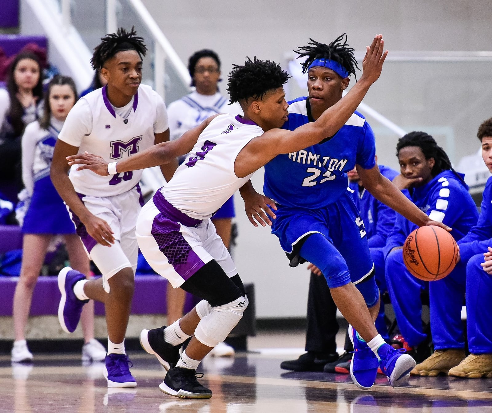 Middletown’s KeiAunte Powell defends Hamilton’s D’Marco Howard during Friday night’s game at Wade E. Miller Arena in Middletown. NICK GRAHAM/STAFF