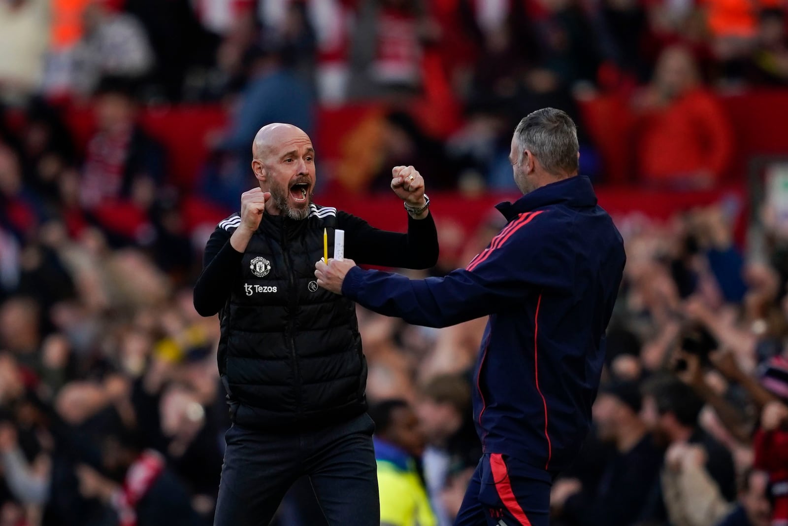 FILE - Manchester United's head coach Erik ten Hag, left, celebrates after Manchester United's Rasmus Hojlund scoring his side's second goal during the English Premier League soccer match between Manchester United and Brentford at Old Trafford stadium in Manchester, England, Saturday, Oct. 19, 2024. (AP Photo/Dave Thompson, File)