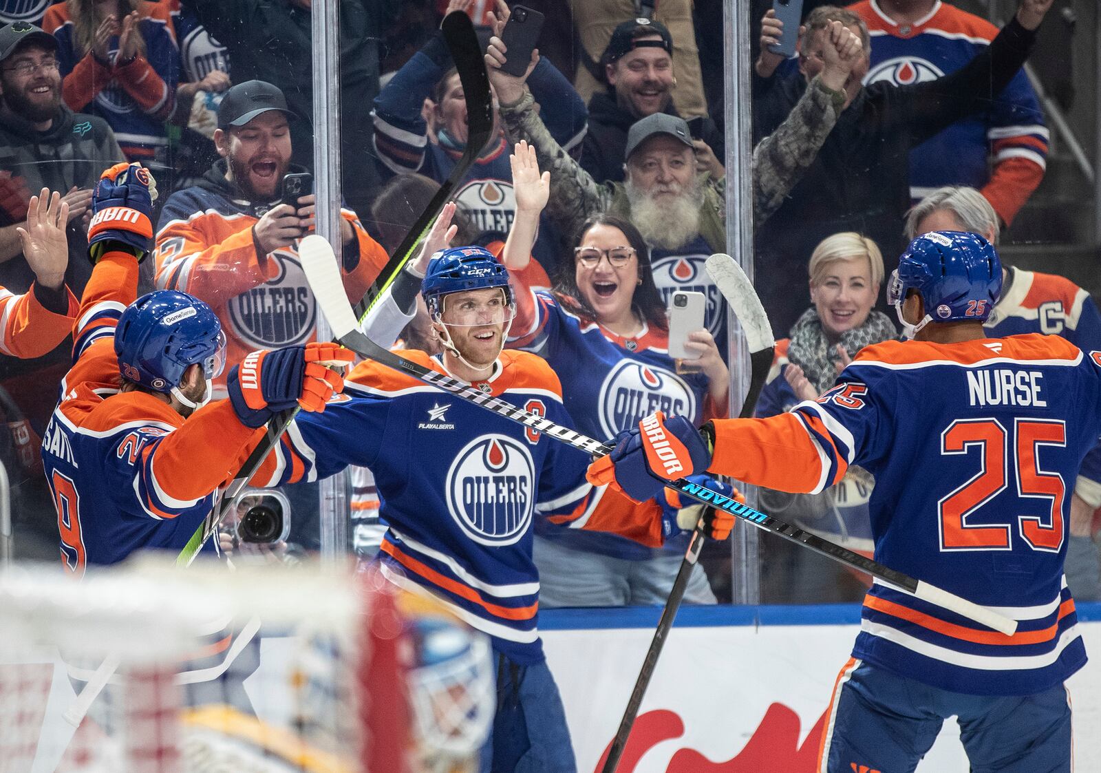 Edmonton Oilers' Connor McDavid (97) celebrates his 1000th point, against the Nashville Predators during the second period of an NHL hockey game, Thursday, Nov. 14, 2024 in Edmonton, Alberta. (Jason Franson/The Canadian Press via AP)