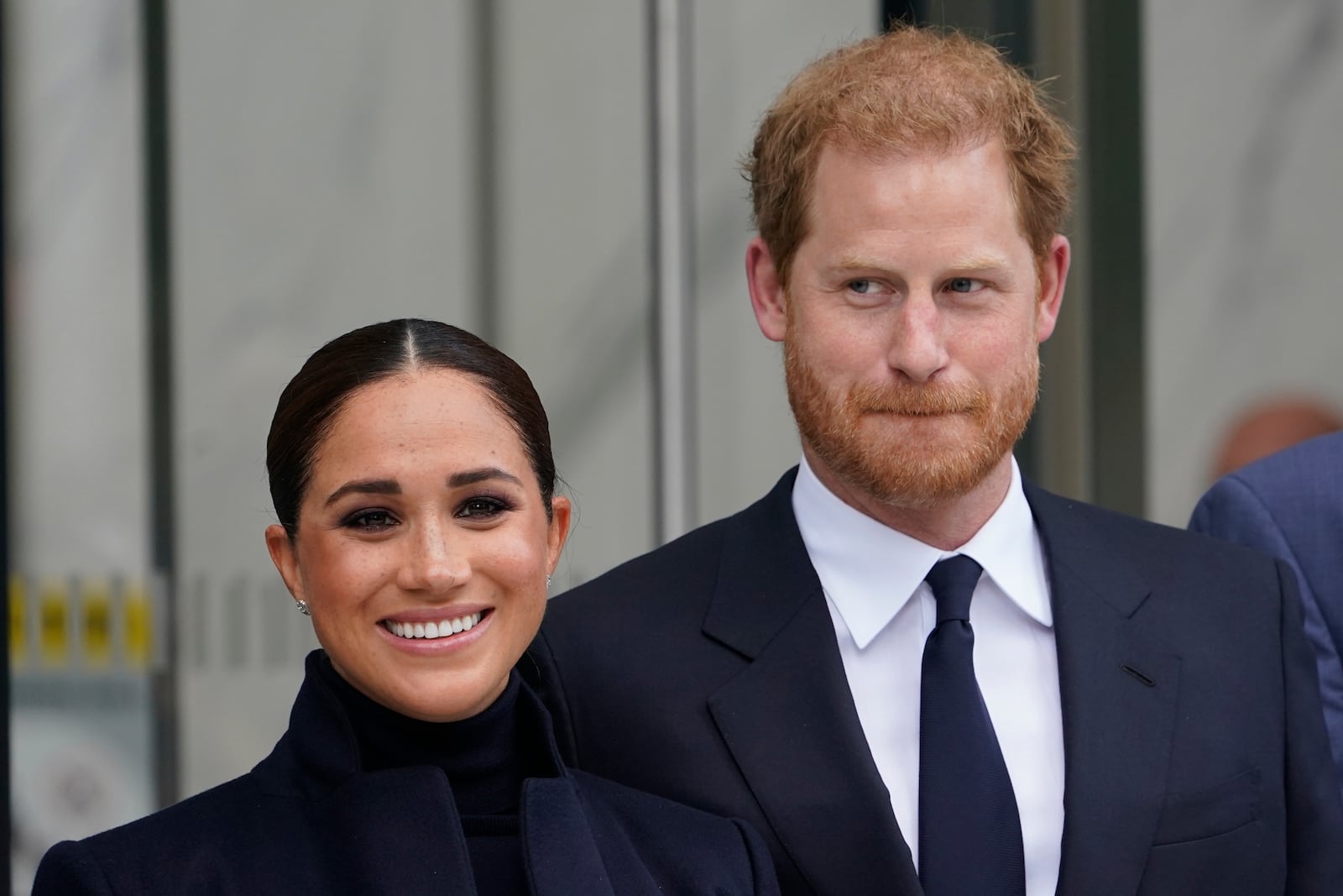 FILE - Meghan Markle and Prince Harry pose for pictures after visiting the observatory in One World Trade in New York, Sept. 23, 2021.(AP Photo/Seth Wenig, File)