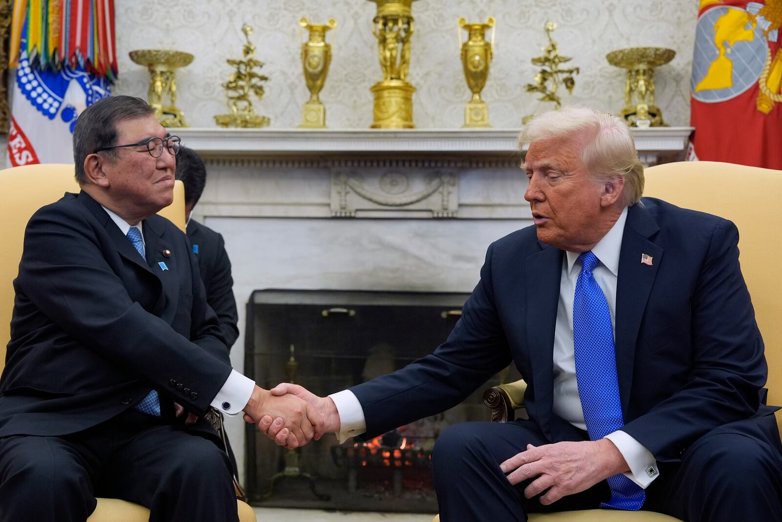 President Donald Trump greets Japanese Prime Minister Shigeru Ishiba in the Oval Office of the White House, Friday, Feb. 7, 2025, in Washington. (AP Photo/Alex Brandon)