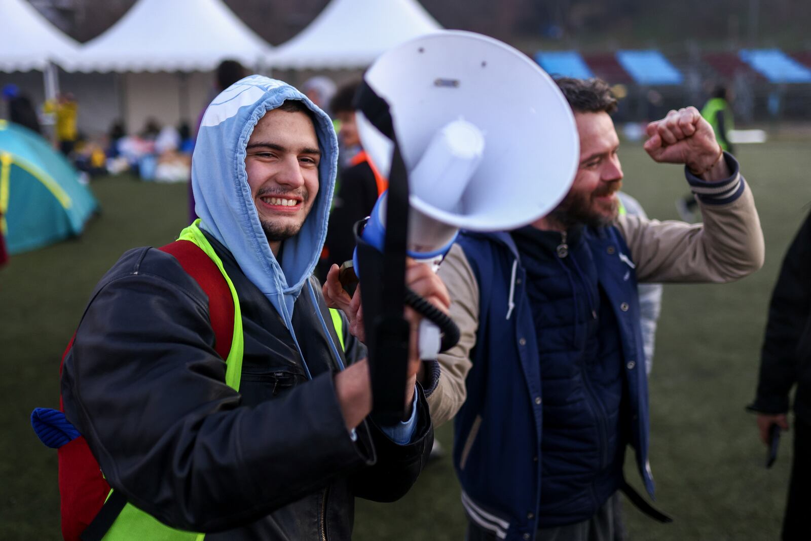 Students play music over a loudspeaker to wake up their colleagues as they take part in a protest over the collapse of a concrete canopy that killed 15 people more than two months ago, in Indjija, Serbia, Friday, Jan. 31, 2025. (AP Photo/Armin Durgut)