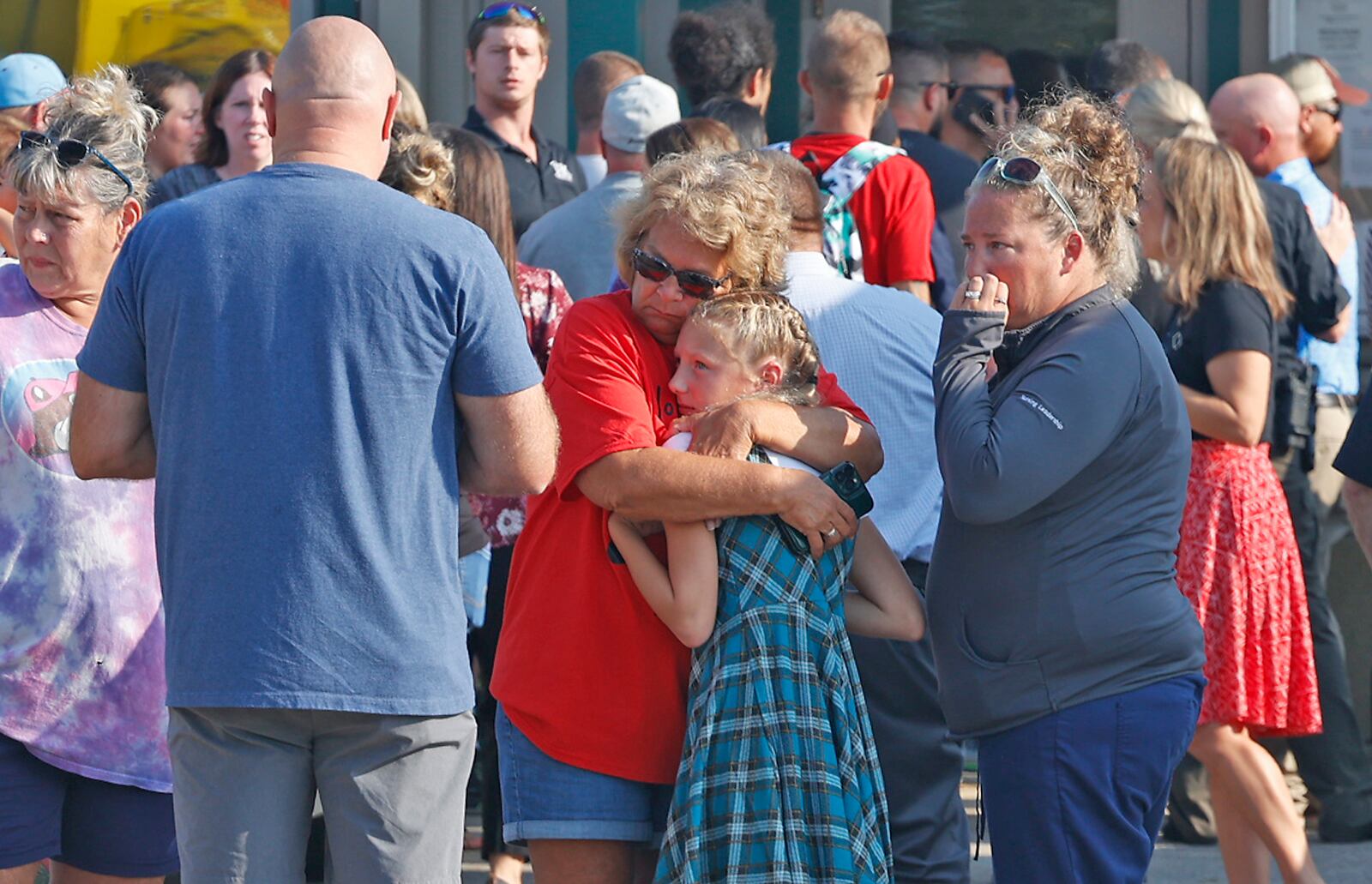 Family members are reunited with their children at the German Township Government Center following a Northwestern School District bus crash on State Route 41 Tuesday, August 22, 2023. BILL LACKEY/STAFF