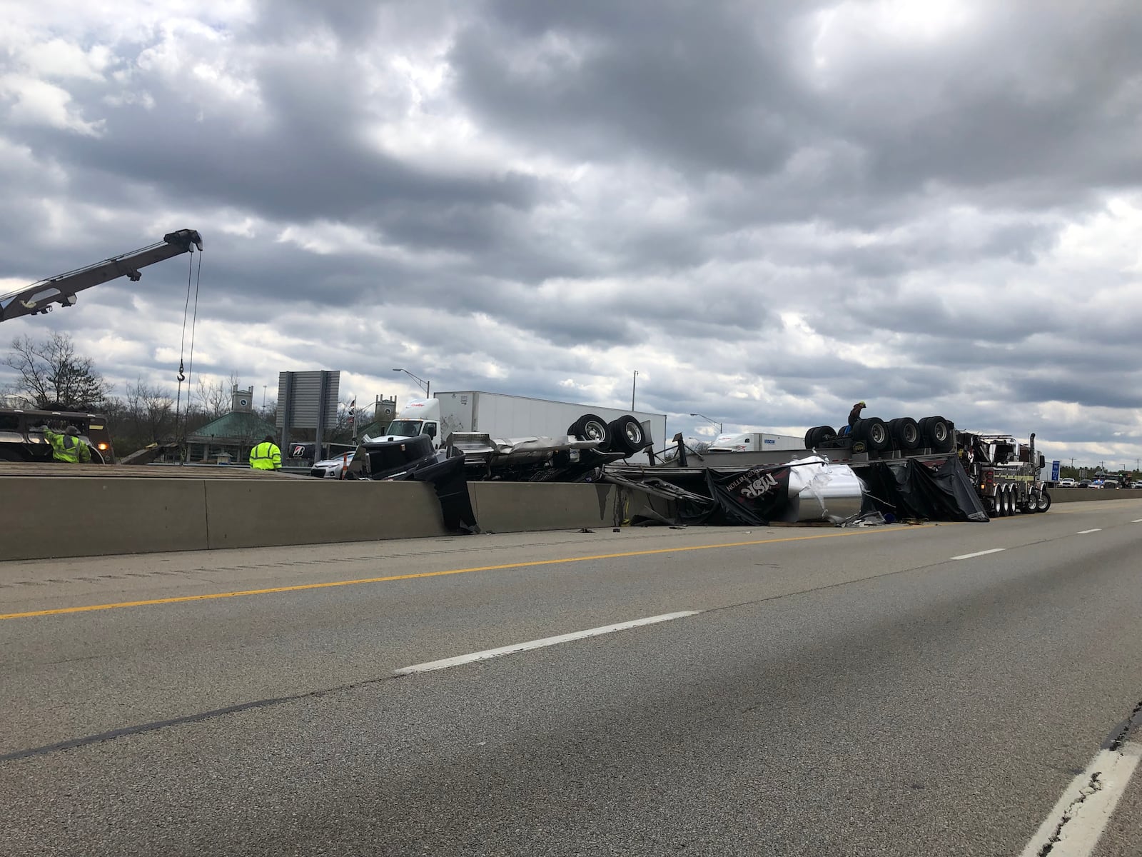 At 1:45 p.m. Tuesday, crews were still working to clean up the area where two semi-tractor trailers had crashed on I-75 in Butler County. One driver was killed in the crash that has caused big traffic backups all day. RICK MCCRABB/STAFF