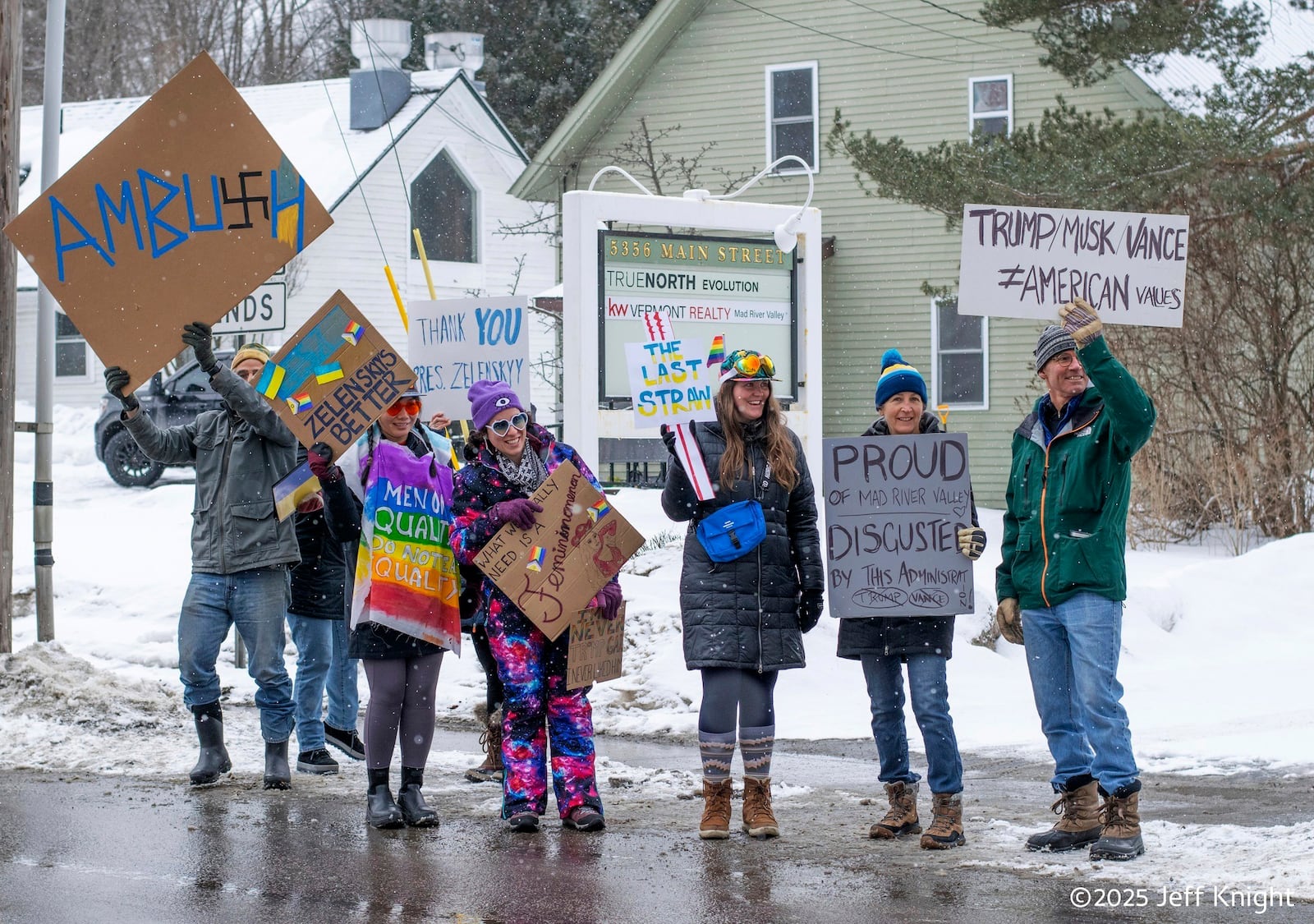 Protesters of Vice President JD Vance are seen on Main Street, Rt. 100, in Waitsfield, Vermont on Saturday, March 1, 2025. (Jeff Knight/The Valley Reporter via AP)