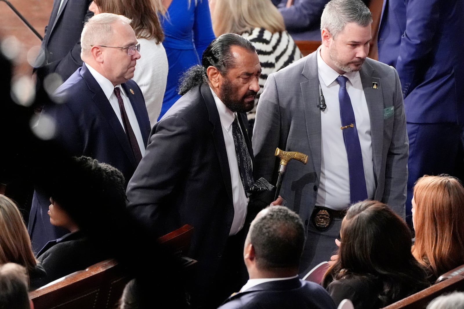 Rep. Al Green, D-Texas, center, is escorted out as President Donald Trump addresses a joint session of Congress at the Capitol in Washington, Tuesday, March 4, 2025. (AP Photo/Alex Brandon)