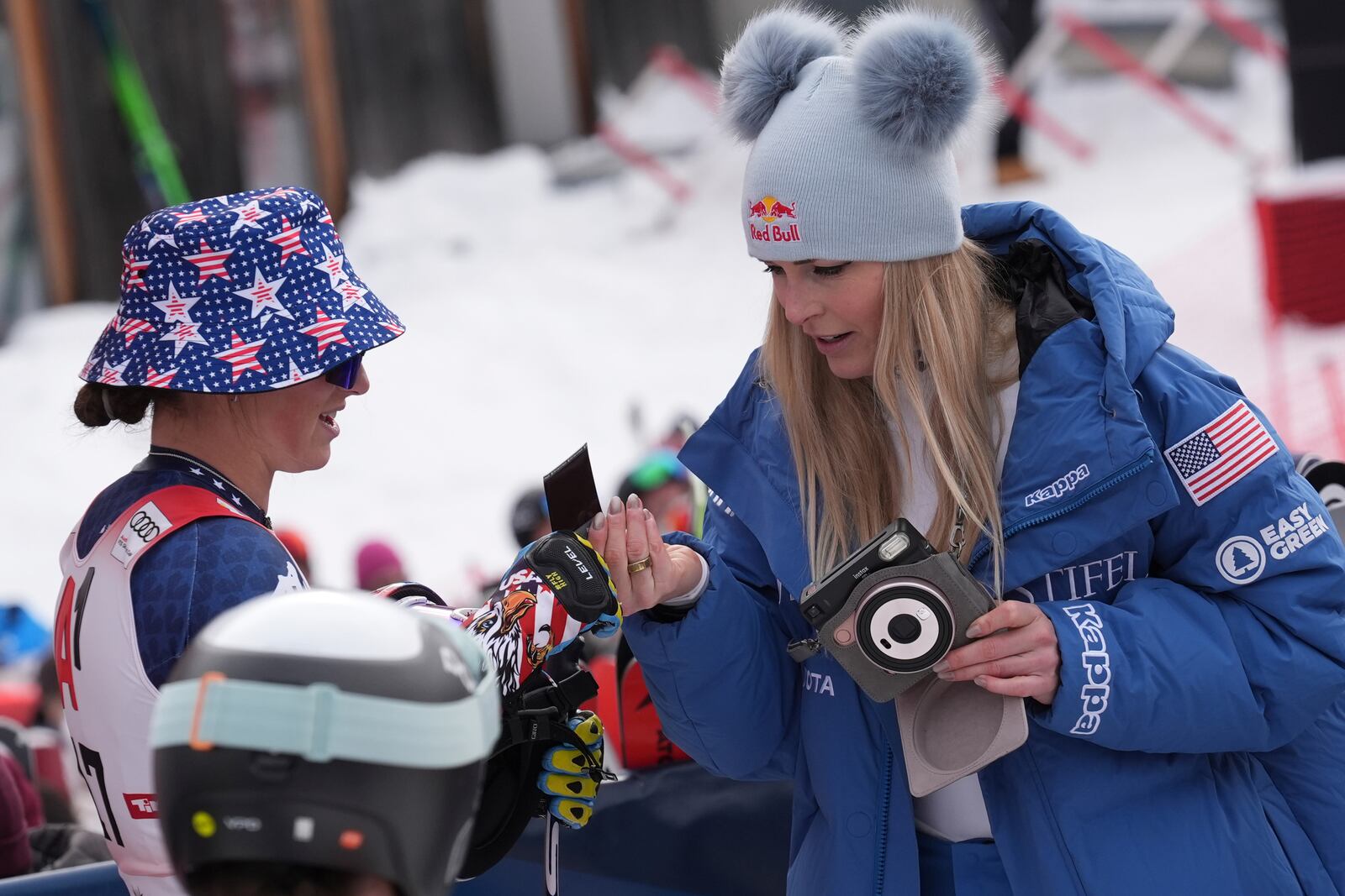 From left, the winner United States' Lauren Macuga and fourth placed Lindsey Von after completing an alpine ski, women's World Cup super G race, in St. Anton, Austria, Sunday, Jan. 12, 2025. (AP Photo/Giovanni Auletta)