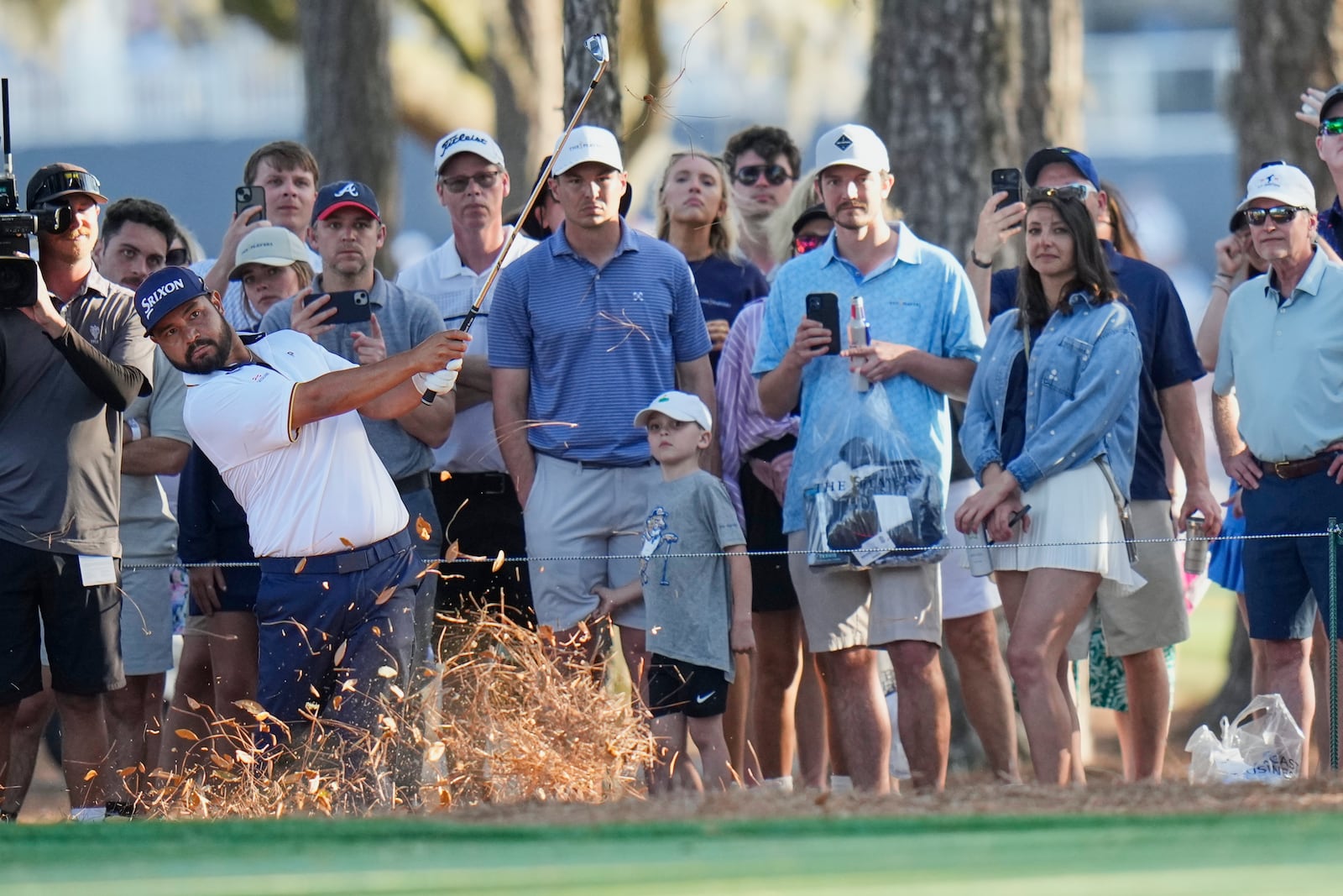 J.J. Spaun hits his second shot on the 15th hole during the third round of The Players Championship golf tournament Saturday, March 15, 2025, in Ponte Vedra Beach, Fla. (AP Photo/Chris O'Meara)