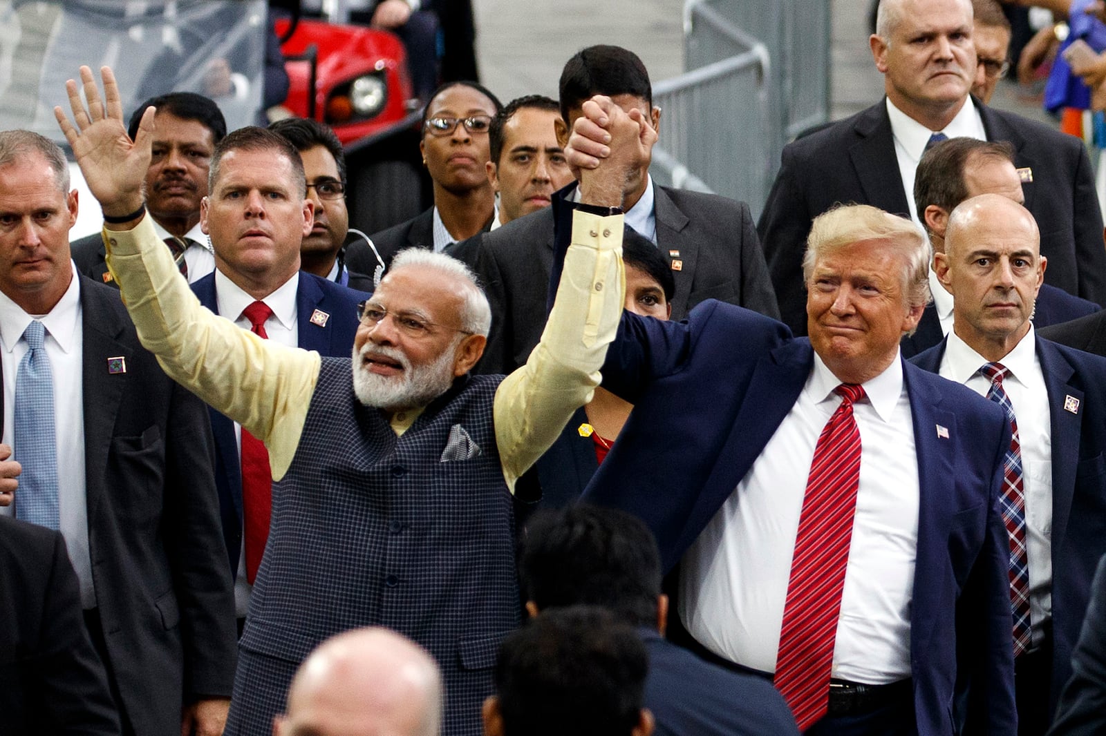 FILE - President Donald Trump and Indian Prime Minister Narendra Modi walk around NRG Stadium waving to the crowd during the "Howdy Modi: Shared Dreams, Bright Futures" event, Sept. 22, 2019, in Houston. (AP Photo/Evan Vucci, File)