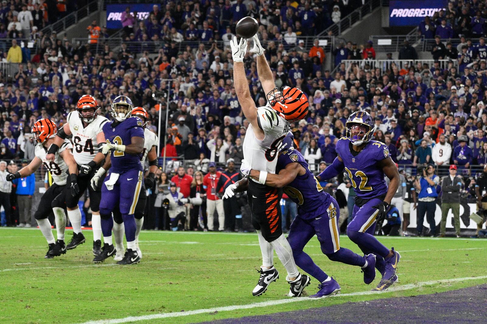 Cincinnati Bengals tight end Tanner Hudson (87) misses a two-point conversion as Baltimore Ravens safety Ar'Darius Washington (29) defends and Baltimore Ravens safety Marcus Williams (32) looks on during the second half of an NFL football game, Thursday, Nov. 7, 2024, in Baltimore. (AP Photo/Nick Wass)