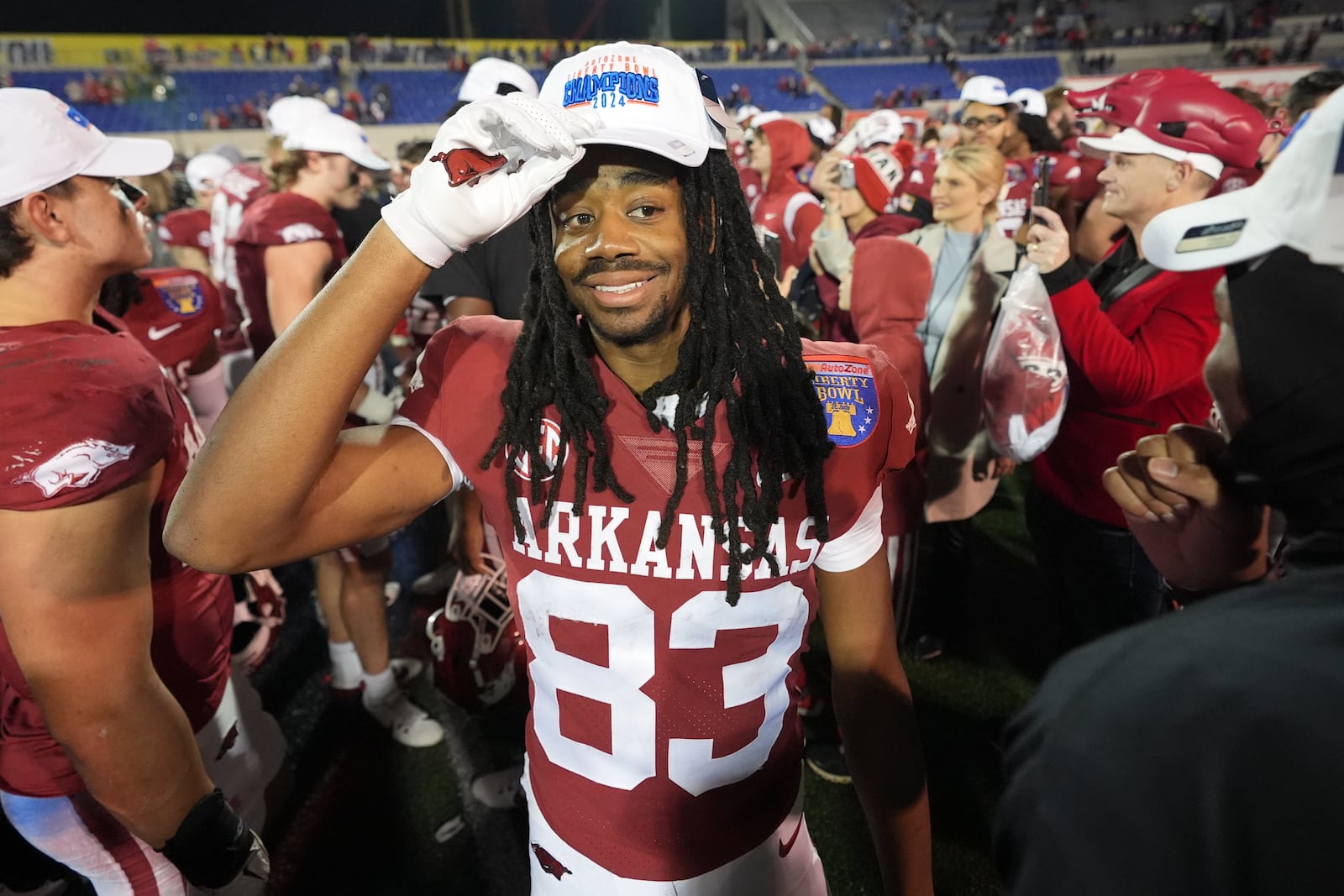 Arkansas wide receiver Dazmin James (83) celebrates the team's win against Texas Tech after the Liberty Bowl NCAA college football game Friday, Dec. 27, 2024, in Memphis, Tenn. (AP Photo/George Walker IV)