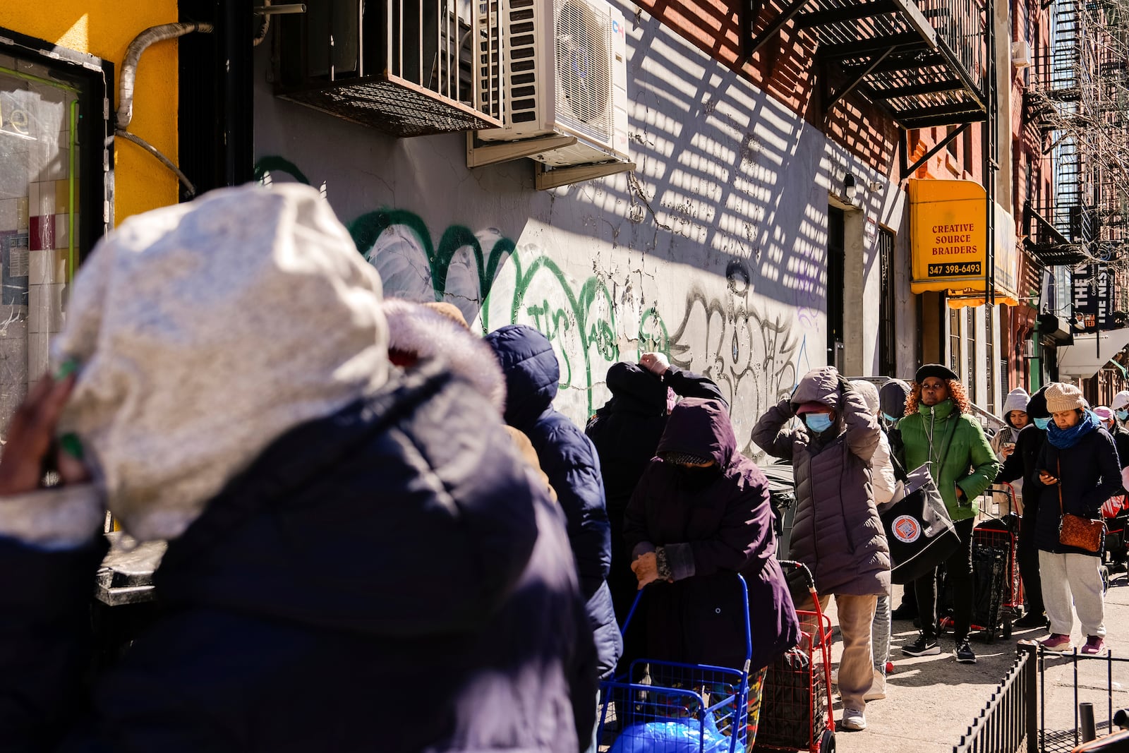 People continue waiting in line after FarmerJawn Agriculture ran out of free eggs at an egg giveaway, Friday, March 21, 2025, in the Harlem neighborhood of New York. (AP Photo/Julia Demaree Nikhinson)