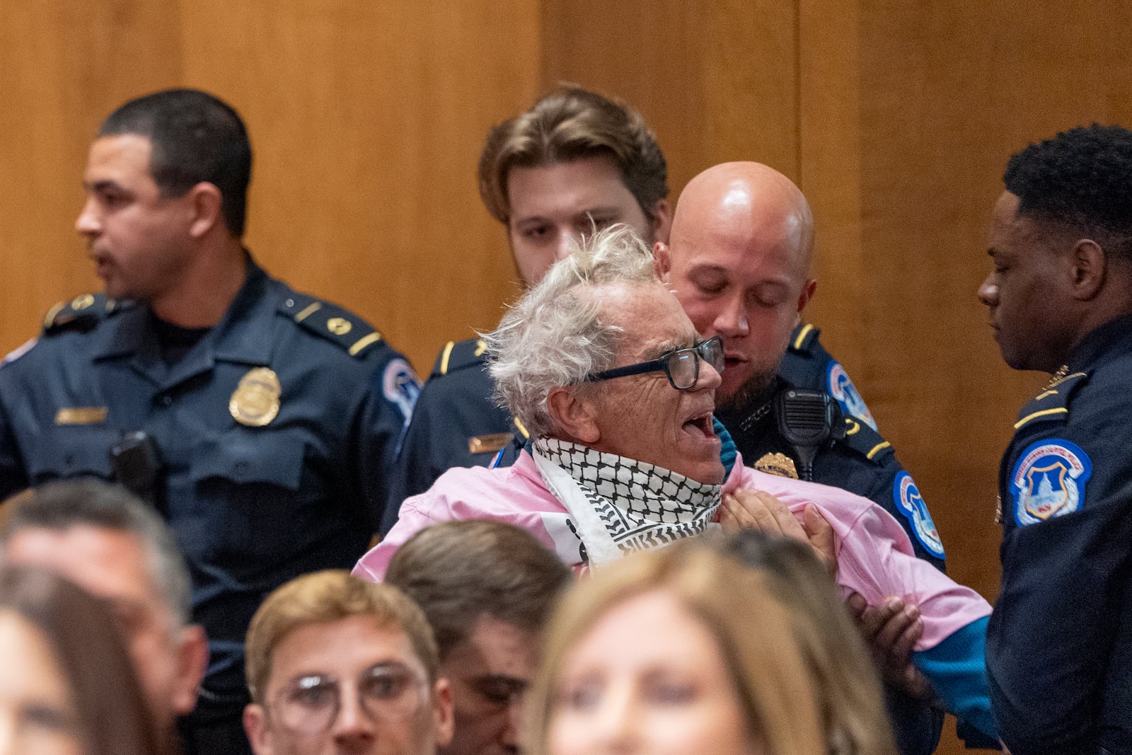 An activist is removed as Sen. Marco Rubio, R-Fla., President-elect Donald Trump's choice to be Secretary of State, appears before the Senate Foreign Relations Committee for his confirmation hearing, at the Capitol in Washington, Wednesday, Jan. 15, 2025. (AP Photo/Alex Brandon)