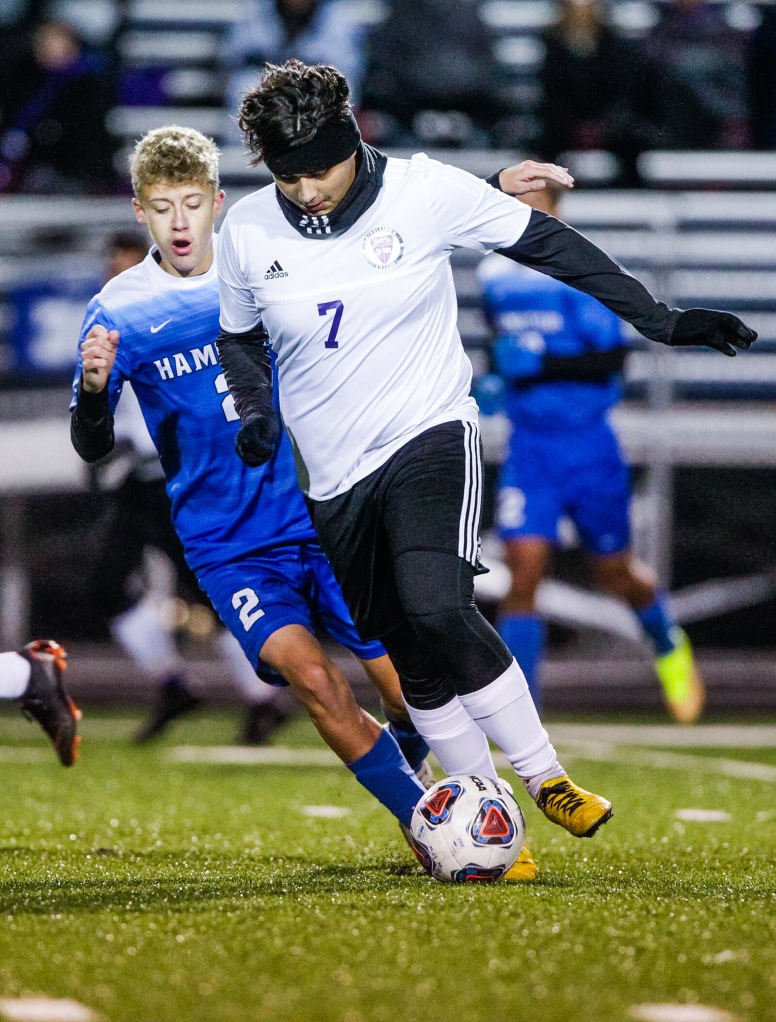 Hamilton’s Chris Thomas and Middletown’s Angel Rivera (7) battle for the ball during Monday night’s Division I sectional contest at Virgil Schwarm Stadium in Hamilton. Host Big Blue won 4-2. NICK GRAHAM/STAFF