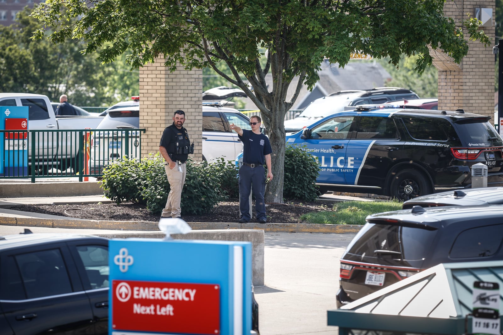 Police were seen outside Miami Valley Hospital's emergency department following a report of a shooting at the hospital complex. JIM NOELKER / STAFF