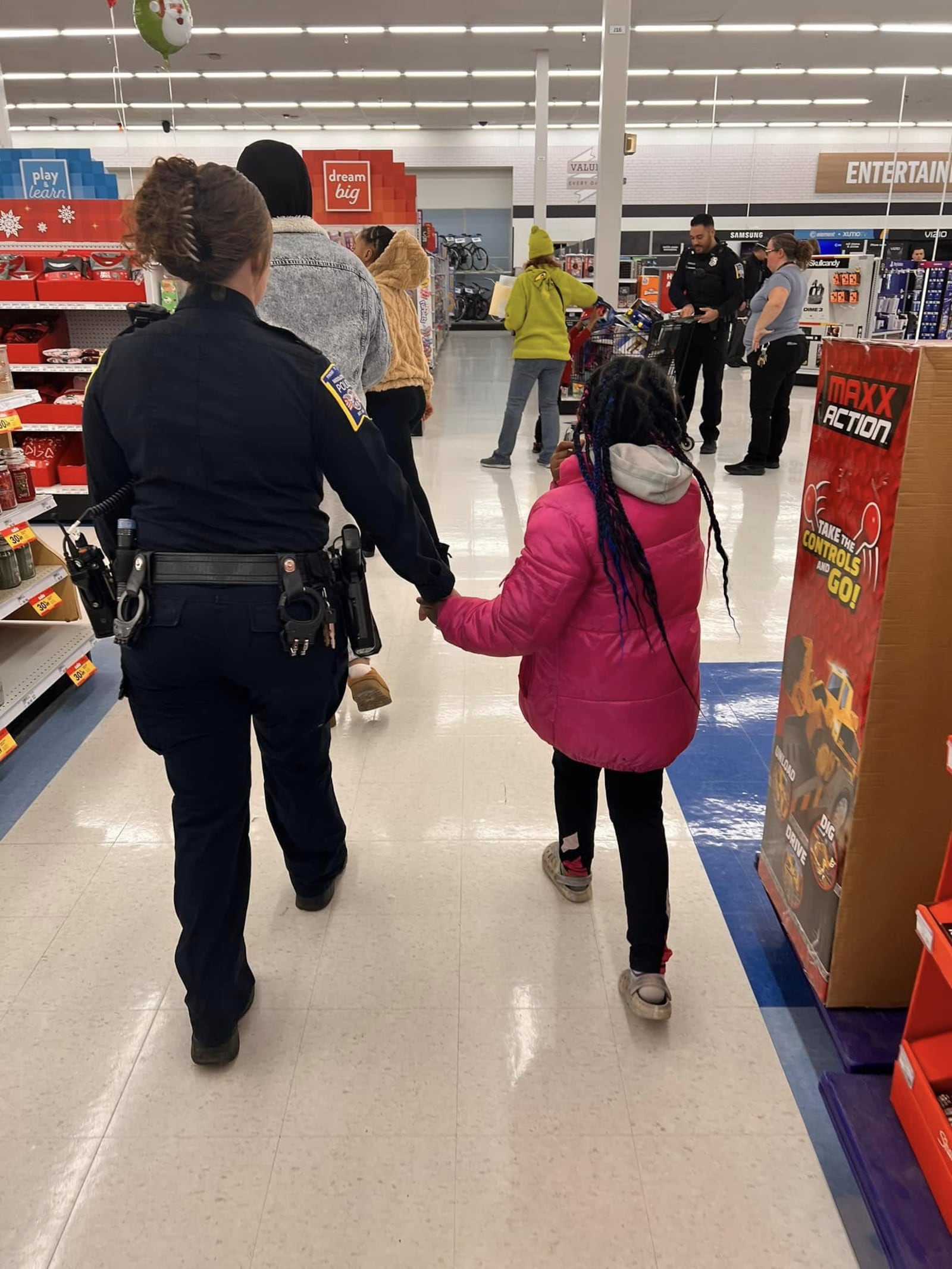 The decades old annual Mike Davis Shop With a Cop happened Saturday with 70 kids and Middletown police employees hitting the isles for Christmas presents. MIDDLETOWN DIVISION OF POLICE