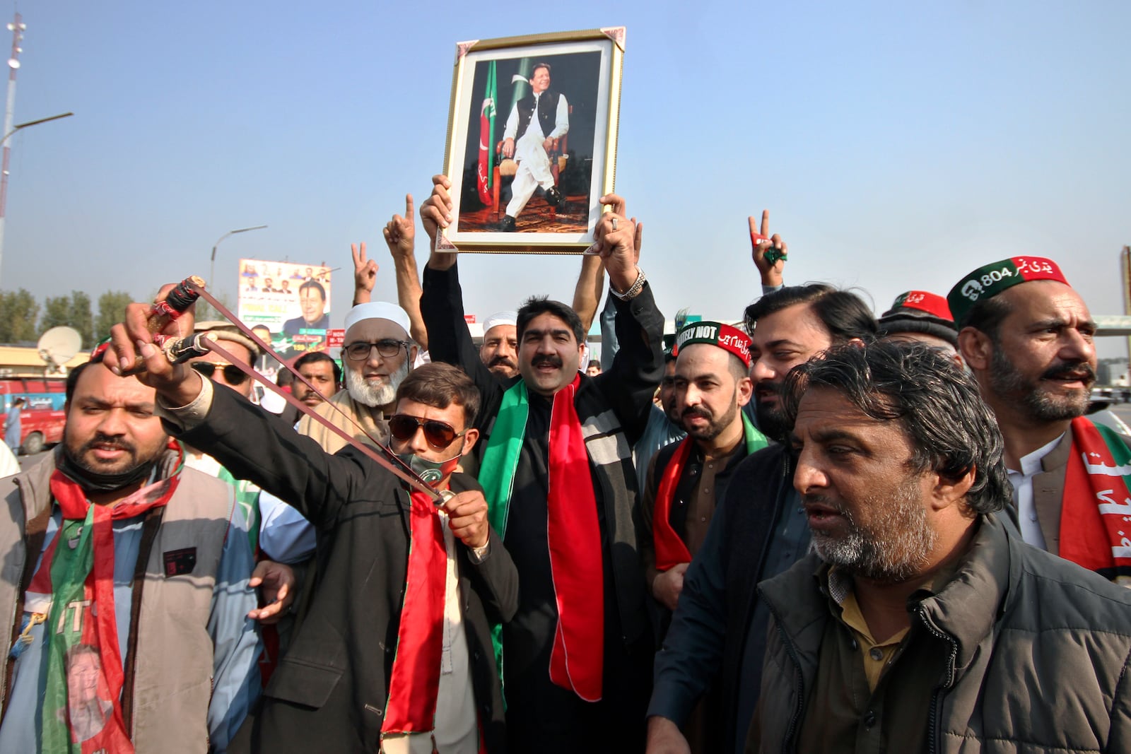 Supporters of imprisoned former premier Imran Khan's Pakistan Tehreek-e-Insaf party, chant slogans before starting a rally for Islamabad to demand Khan's release, in Peshawar, Pakistan, Sunday, Nov. 24, 2024. (AP Photo/Muhammad Sajjad)