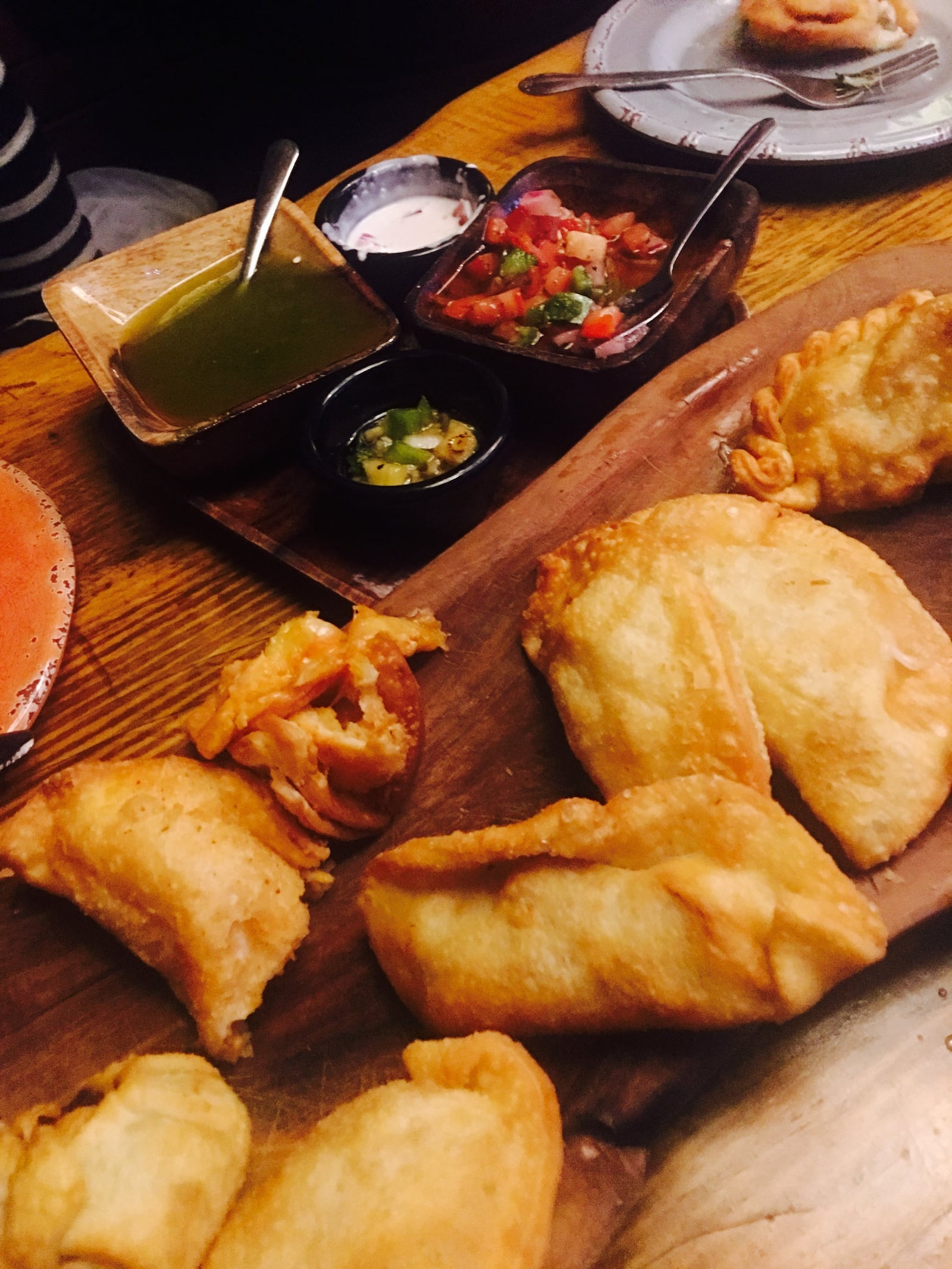 Grab a platter of empanadas to share with the table at Che OTR in Cincinnati, Ohio. KARA DRISCOLL/STAFF