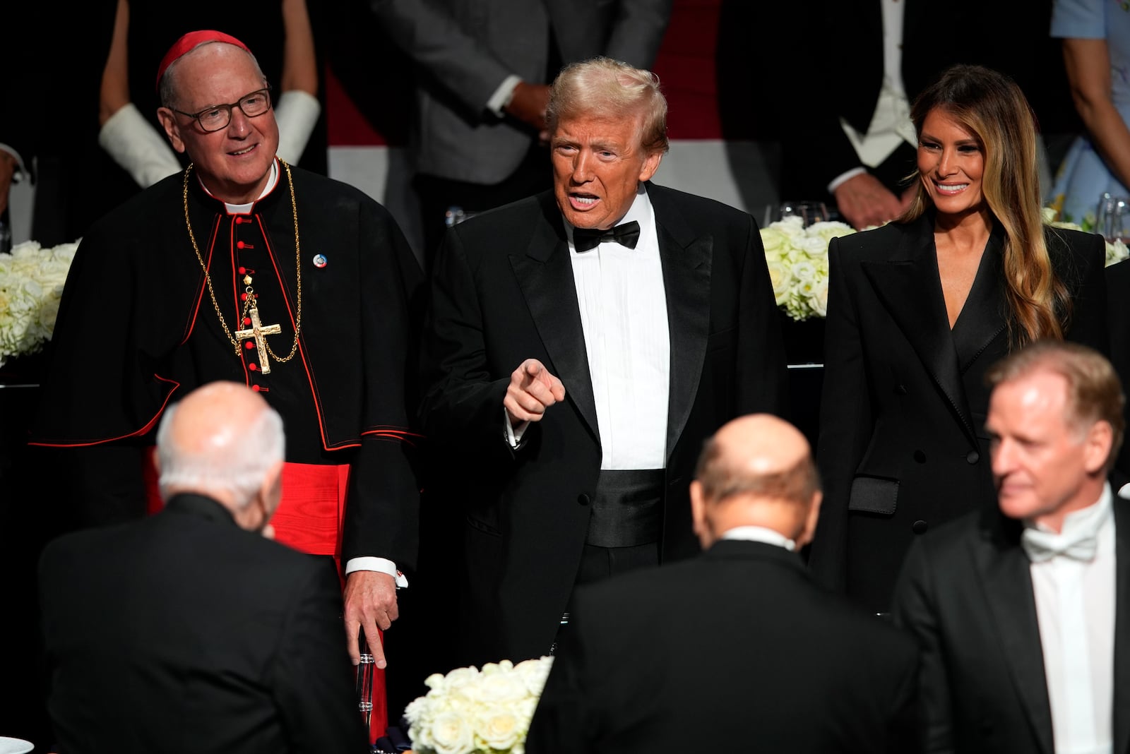 Republican presidential nominee former President Donald Trump and former first lady Melania Trump arrive for the 79th annual Alfred E. Smith Memorial Foundation Dinner, Thursday, Oct. 17, 2024, in New York. (AP Photo/Julia Demaree Nikhinson)