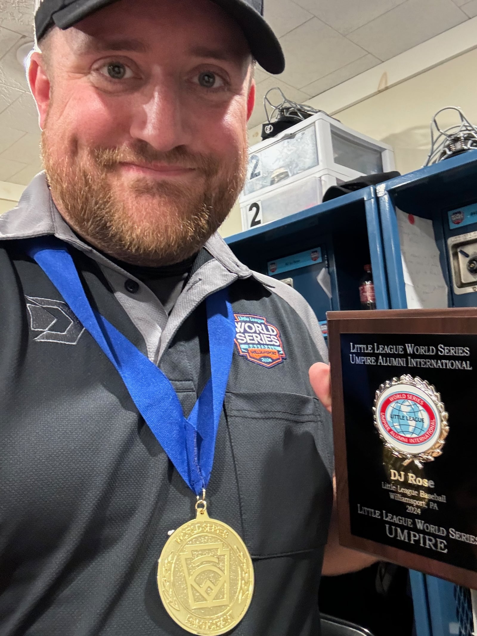 DJ Rose shows off a plaque he received for umpiring in the Little League World Series in Williamsport, Pa. Contributed photo