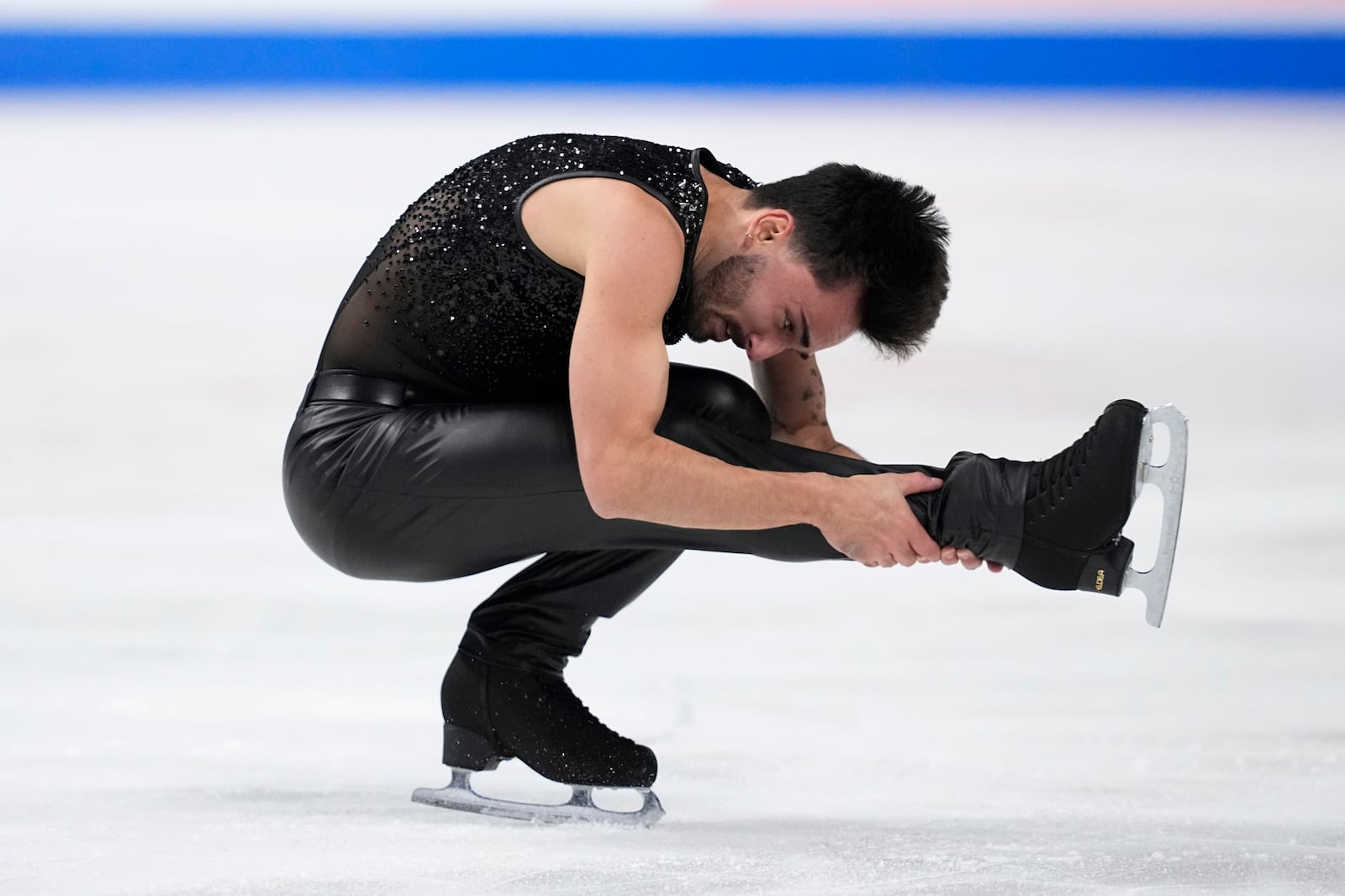 Kevin Aymoz of France competes during the men's short program at the Skate America figure skating event in Allen, Texas, Saturday, Oct. 19, 2024. (AP Photo/Tony Gutierrez)