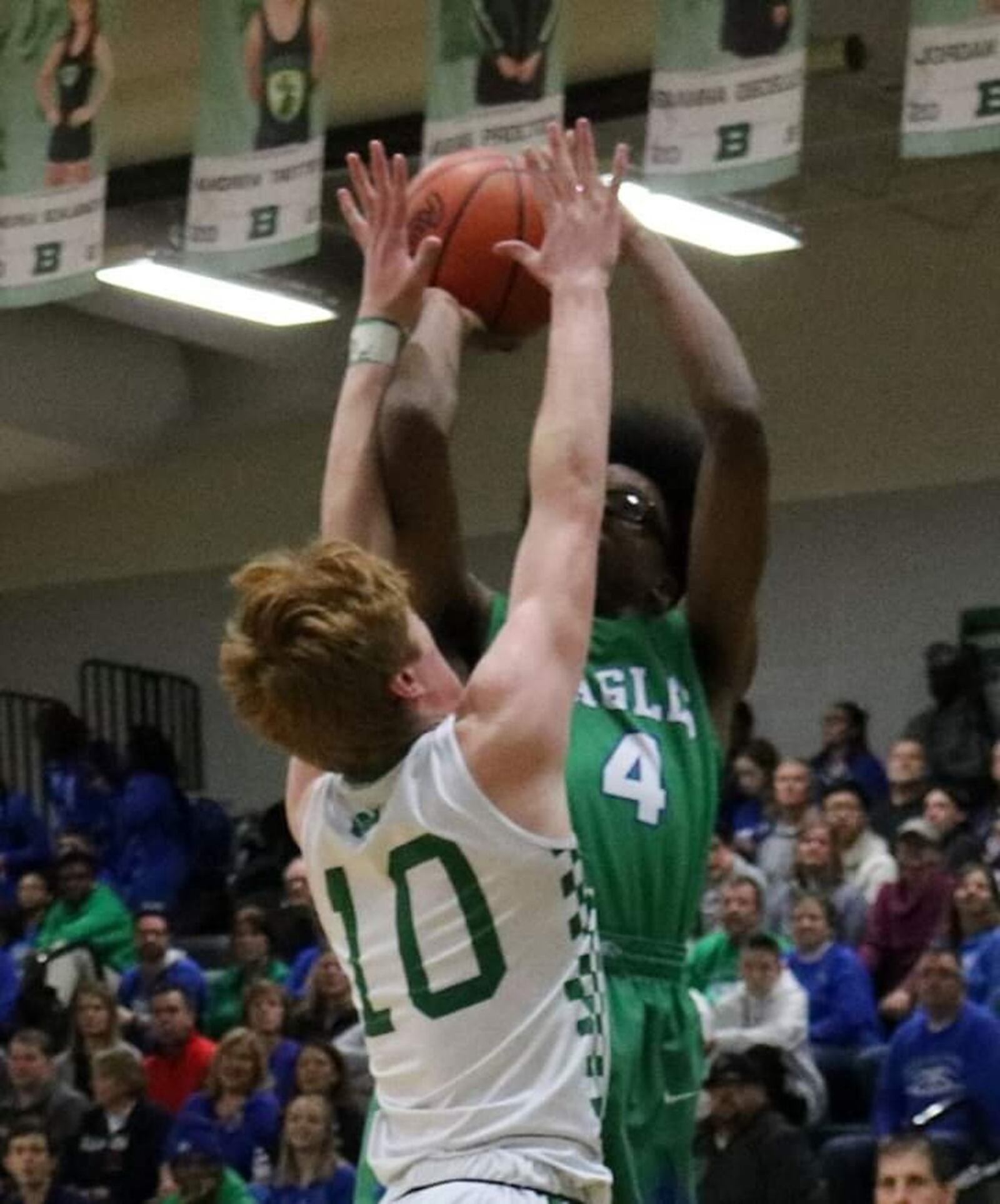 Badin’s Zach Switzer defends Chaminade Julienne’s Larry Turner (4) during Friday night’s game at Mulcahey Gym in Hamilton. CJ won 58-54. CONTRIBUTED PHOTO BY TERRI ADAMS