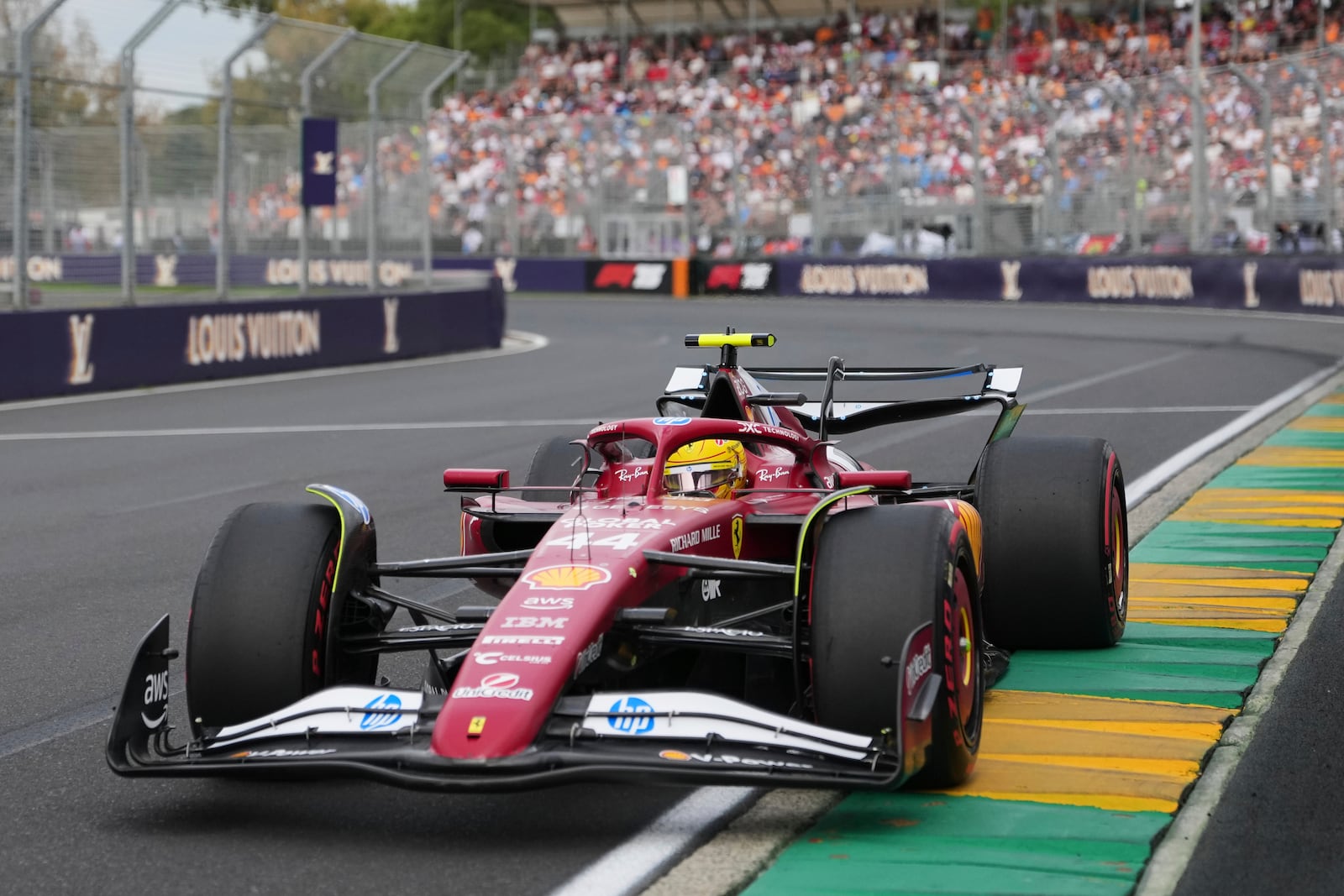 Ferrari driver Lewis Hamilton of Britain steers his car during qualifying at the Australian Formula One Grand Prix at Albert Park, in Melbourne, Australia, Saturday, March 15, 2025. (AP Photo/Scott Barbour)