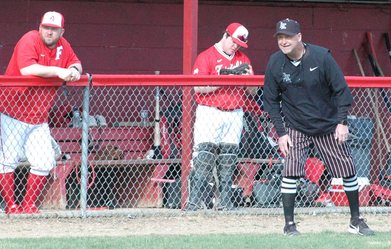 Lakota East coach Ray Hamilton reacts to a run by his team Wednesday during a 2-1 Greater Miami Conference baseball victory over host Fairfield at Joe Nuxhall Field. RICK CASSANO/STAFF