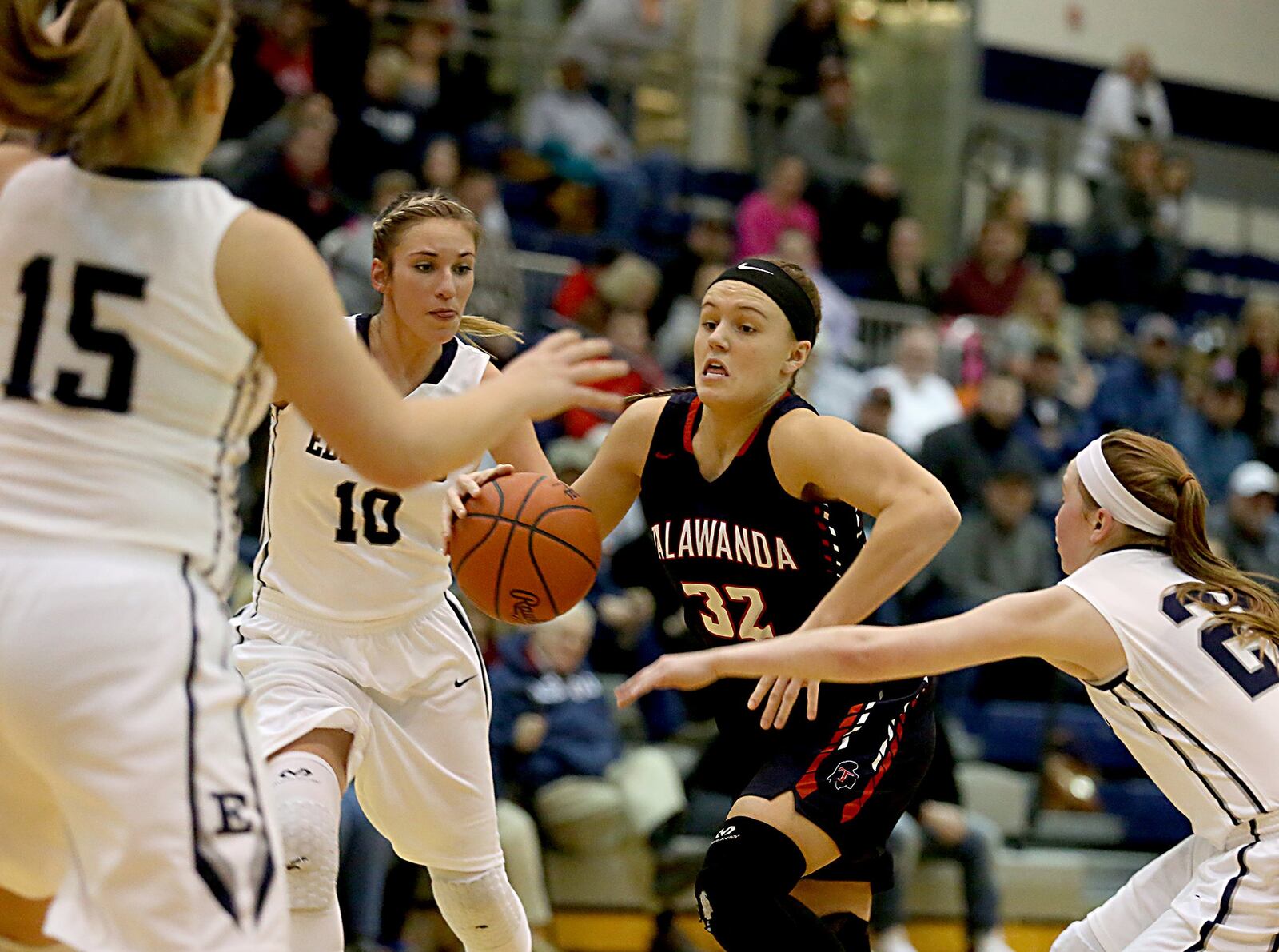 Talawanda guard Hannah Hurst attempts to drive through Edgewood’s Kayla Curtis (15), Lauren Gerber (10) and Cierra Lipps (21) during Wednesday night’s game at Ron Kash Court in Trenton. CONTRIBUTED PHOTO BY E.L. HUBBARD