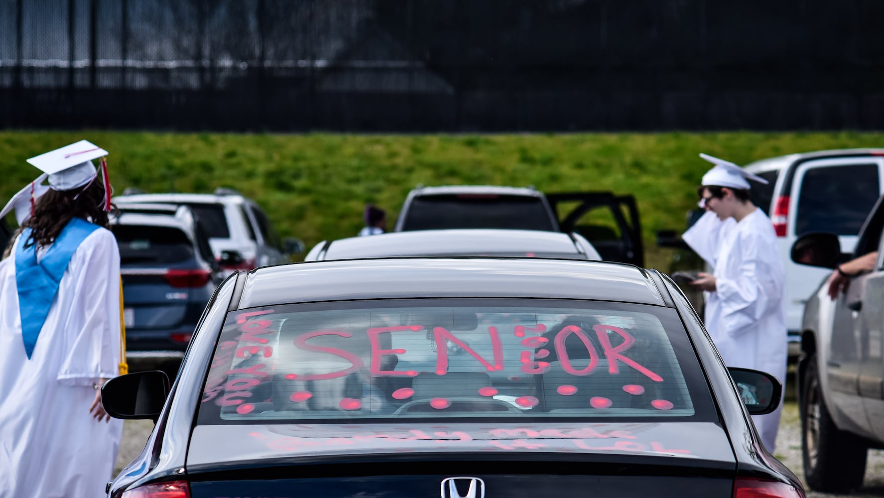 Madison High School drive-thru graduation ceremony at Land of Illusion