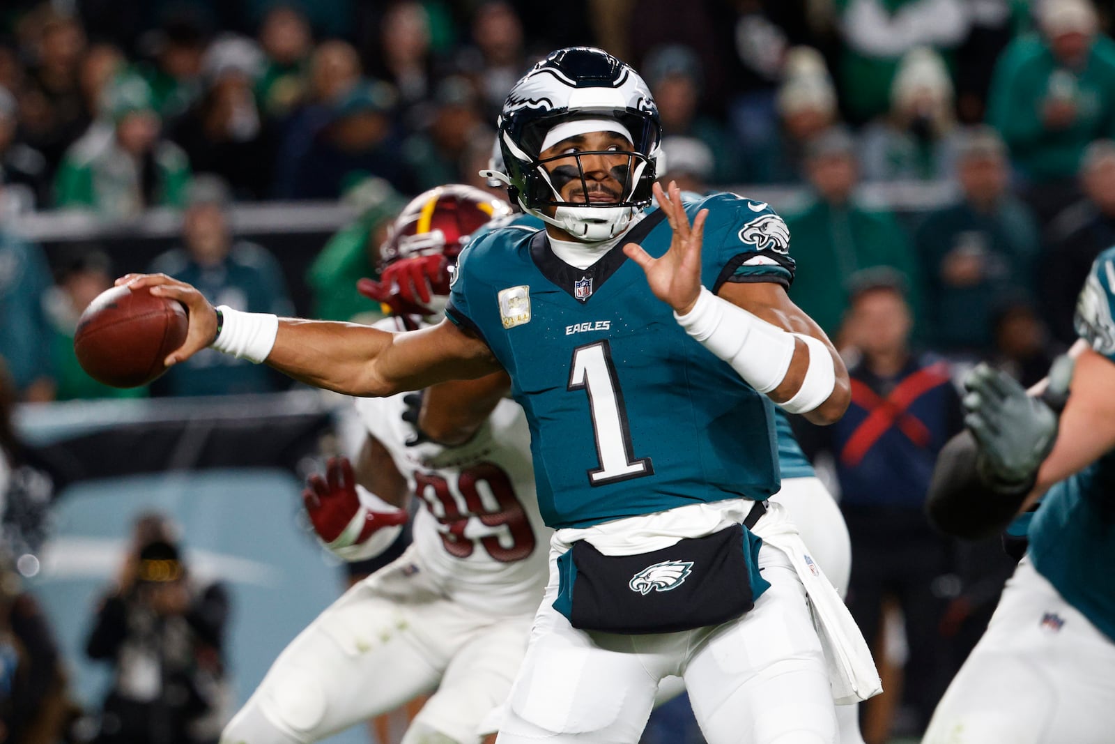 Philadelphia Eagles quarterback Jalen Hurts throws during the first half of an NFL football game against the Washington Commanders Thursday, Nov. 14, 2024, in Philadelphia. (AP Photo/Laurence Kesterson)