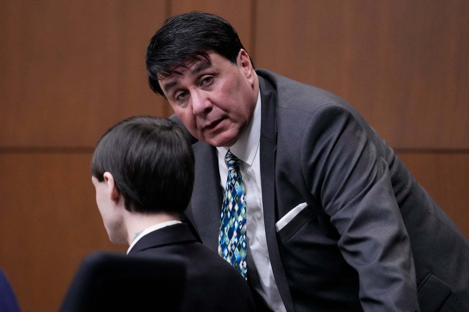 Robert E. Crimo III's attorney Gregory Ticsay, right, talks to Robert E. Crimo III., during the jury selection for the trial of Robert E. Crimo III., at the Lake County Courthouse, Waukegan, Ill., Monday, Feb. 24, 2025. (AP Photo/Nam Y. Huh, Pool)