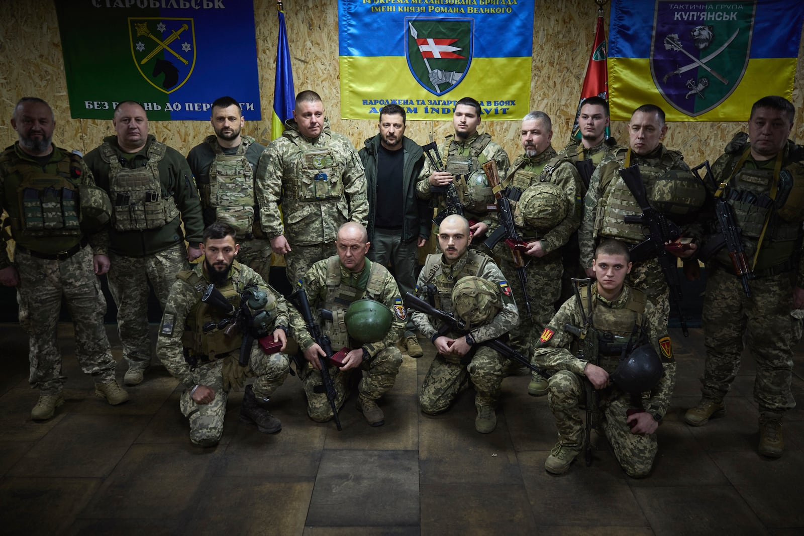 In this photo provided by the Ukrainian Presidential Press Office, Ukrainian President Volodymyr Zelenskyy, center, poses for a photo surrounded by soldiers in the frontline city of Kupiansk, the site of heaviest battles with the Russian troops in the Kharkiv region, Ukraine, Monday, Nov. 18, 2024. (Ukrainian Presidential Press Office via AP)