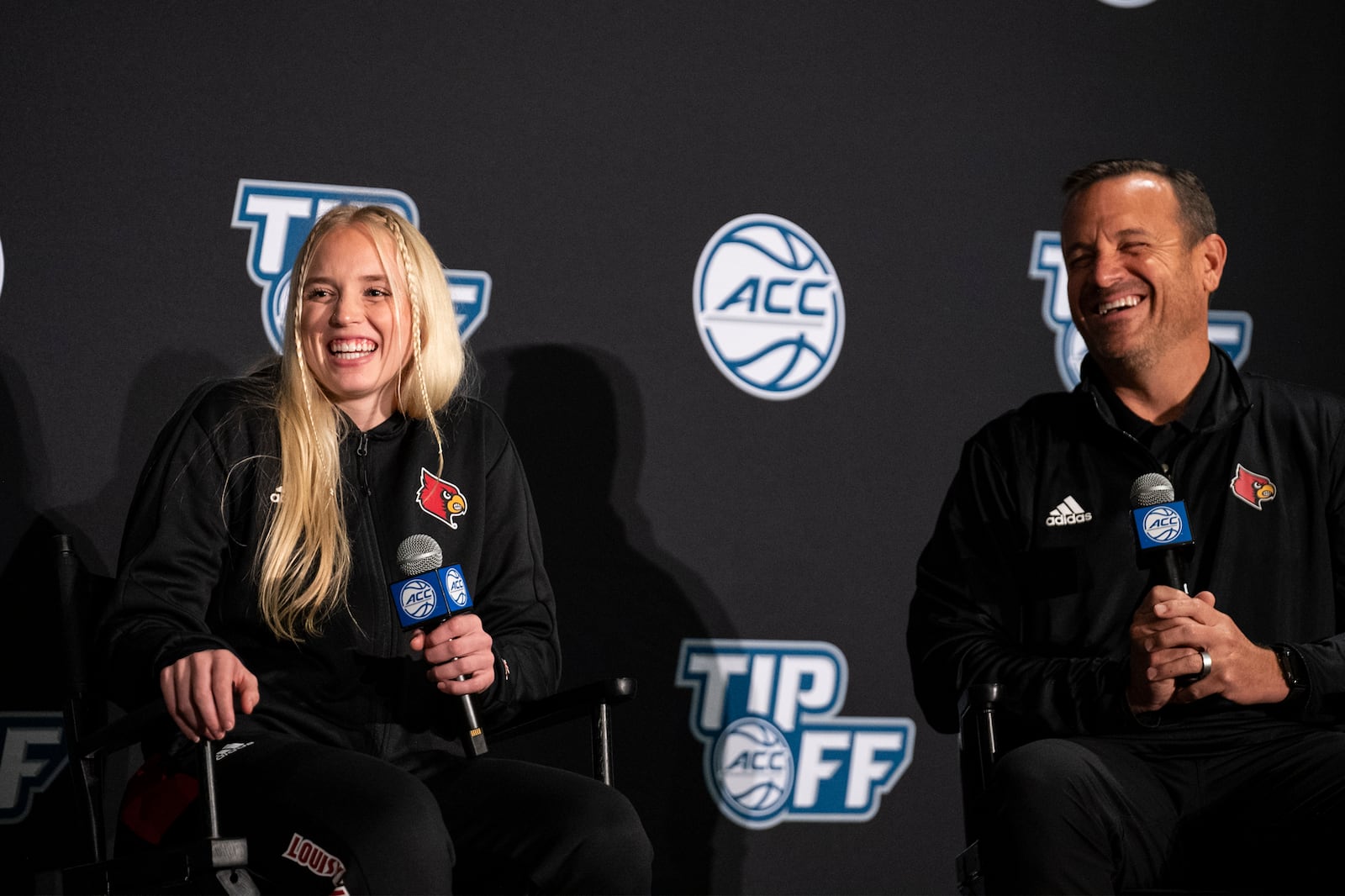 FILE - Louisville guard Hailey Van Lith and head coach Jeff Walz laugh during NCAA college basketball Atlantic Coast Conference media day, Thursday, Oct. 14, 2021, in Charlotte, N.C. (AP Photo/Matt Kelley, File)