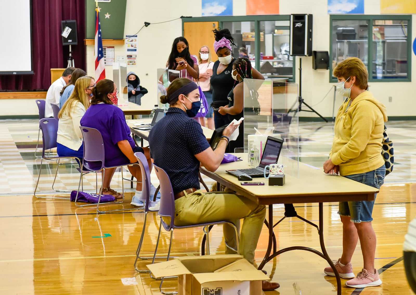 Middletown School district is handing out laptops this week to students in grades 1 through 12 in preparation for remote learning for the start of the school year. Students picked up laptops, mobile hotspots and other supplies at Mayfield Elementary School Monday, August 17, 2020 in Middletown. NICK GRAHAM / STAFF 